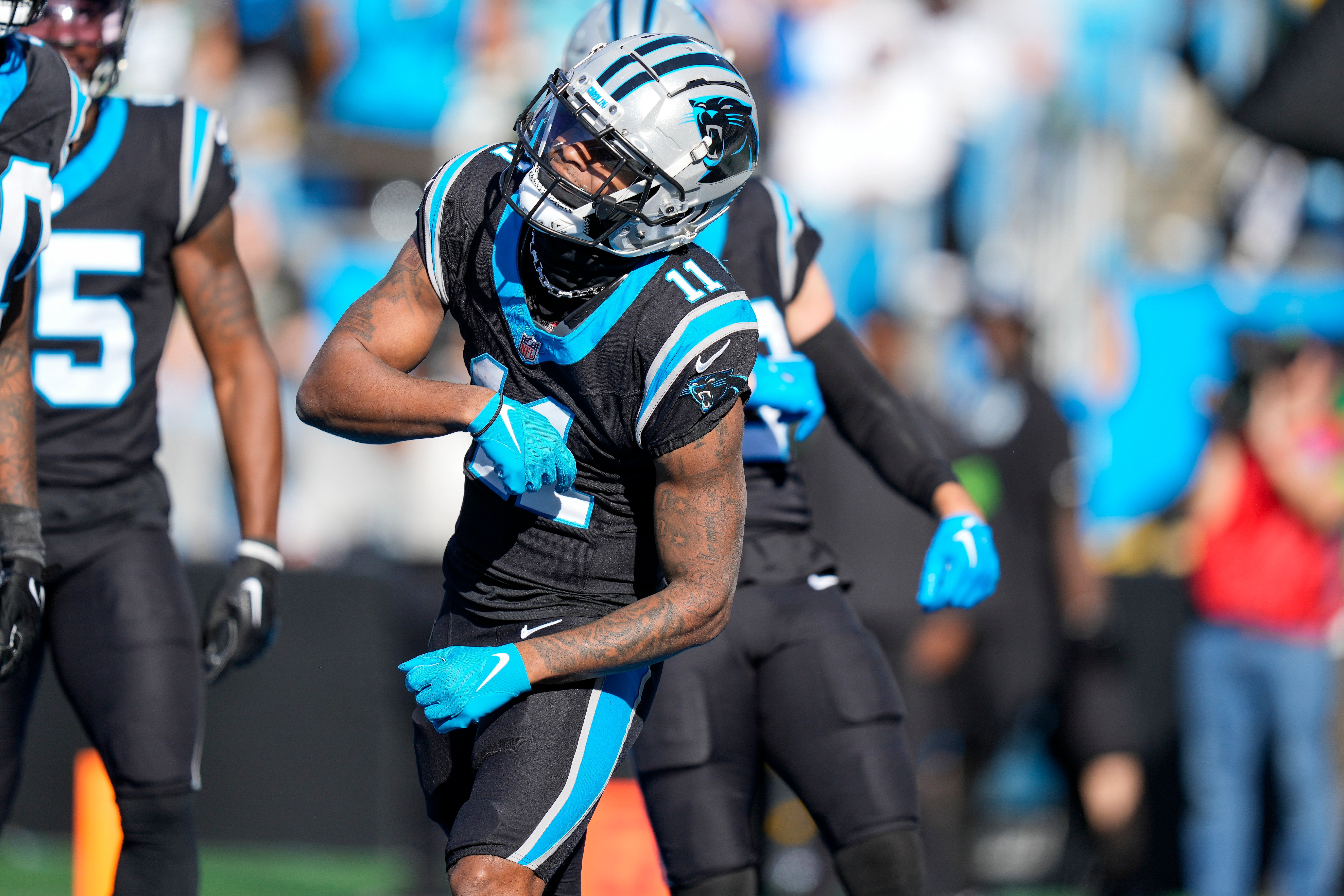 Dec 24, 2023; Charlotte, North Carolina, USA; Carolina Panthers wide receiver Ihmir Smith-Marsette (11) celebrates his touchdown with teammate against the Green Bay Packers during the second quarter at Bank of America Stadium. Mandatory Credit: Jim Dedmon-USA TODAY Sports
