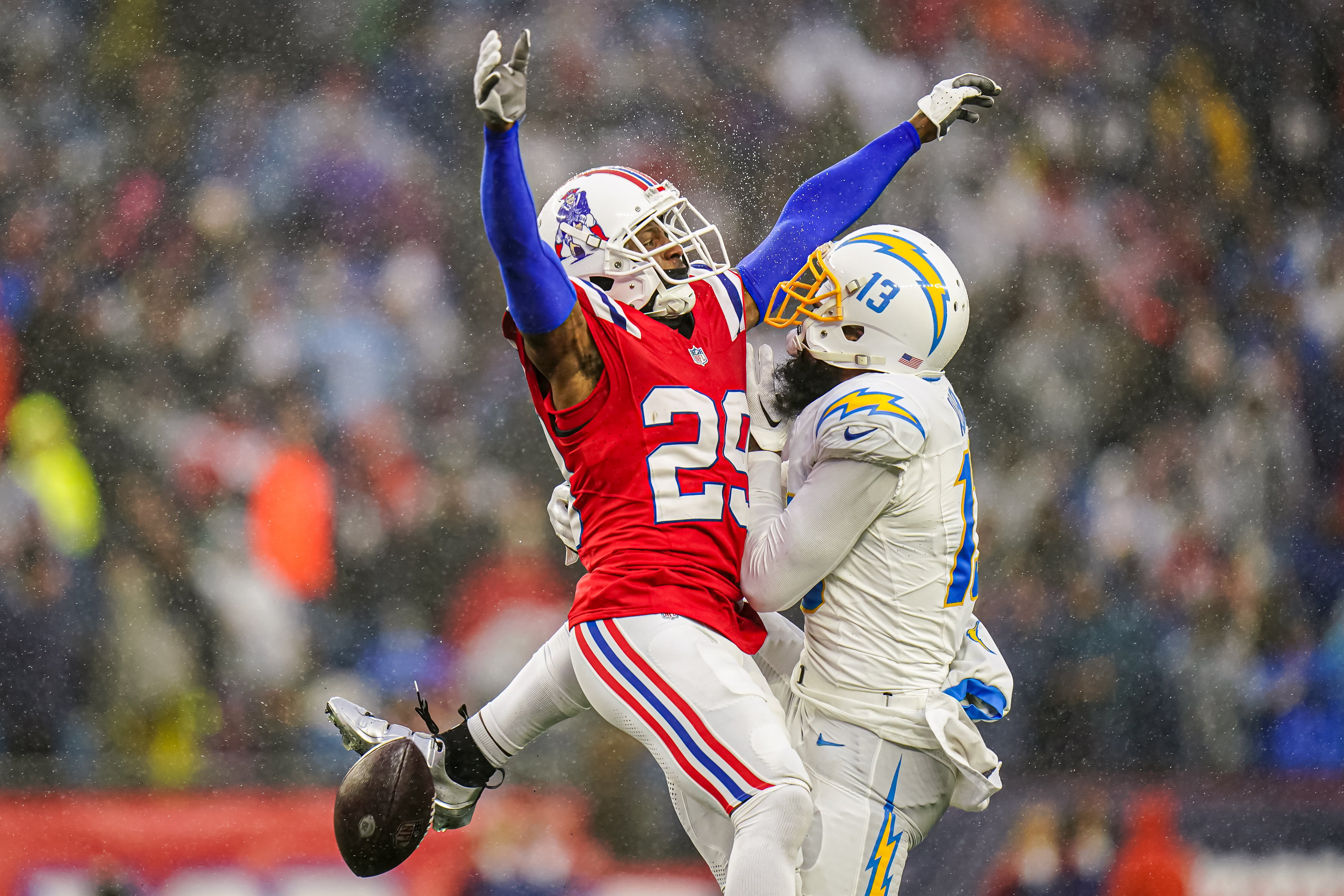 Dec 3, 2023; Foxborough, Massachusetts, USA; New England Patriots cornerback J.C. Jackson (29) breaks up a pass intended for Los Angeles Chargers wide receiver Keenan Allen (13) in the second half at Gillette Stadium.