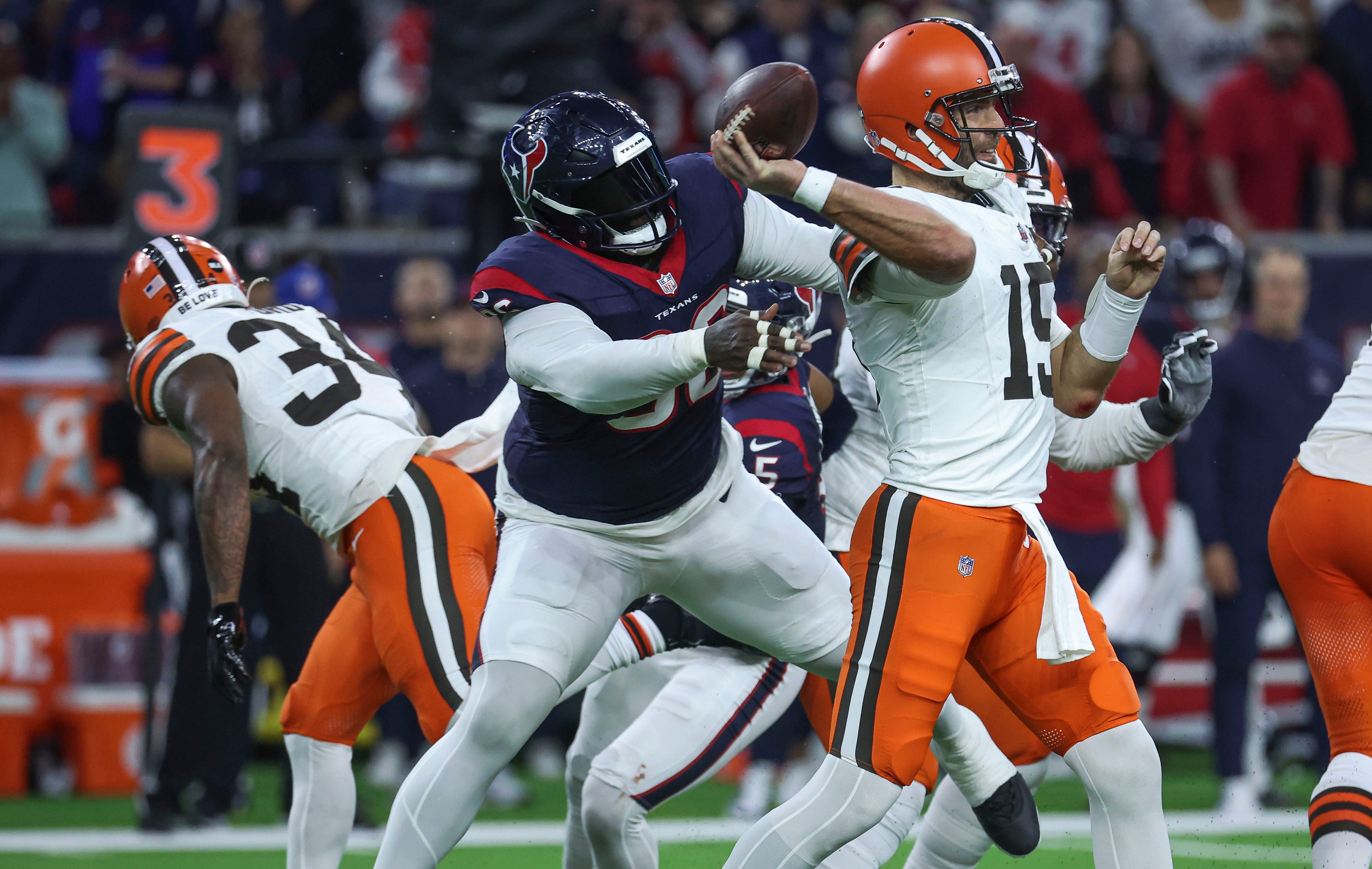 Jan 13, 2024; Houston, Texas, USA; Houston Texans defensive tackle Maliek Collins (96) applies defensive pressure against Cleveland Browns quarterback Joe Flacco (15) in a 2024 AFC wild card game at NRG Stadium.