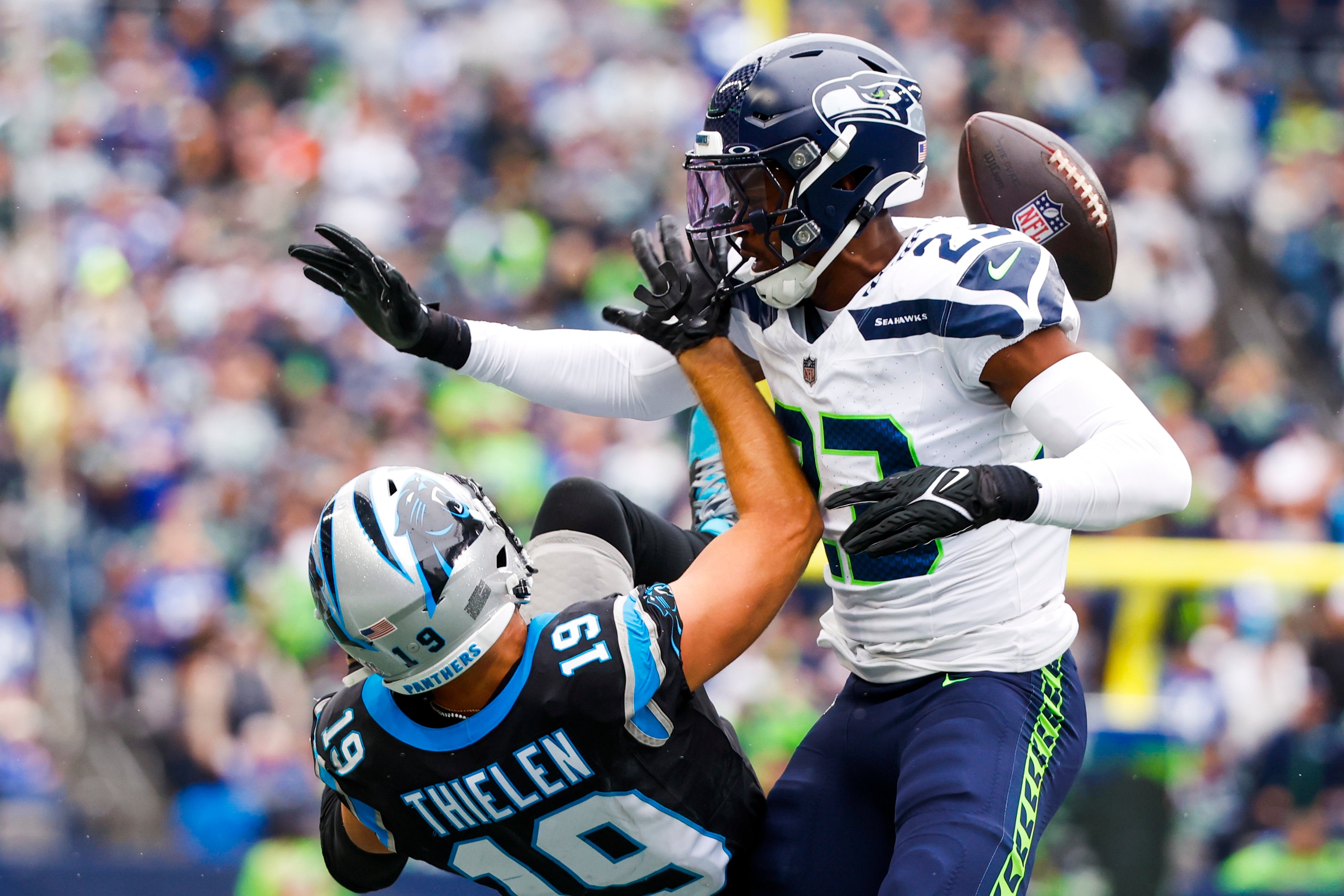Sep 24, 2023; Seattle, Washington, USA; Seattle Seahawks cornerback Artie Burns (23) defends a pass intended for Carolina Panthers wide receiver Adam Thielen (19) during the second quarter at Lumen Field.