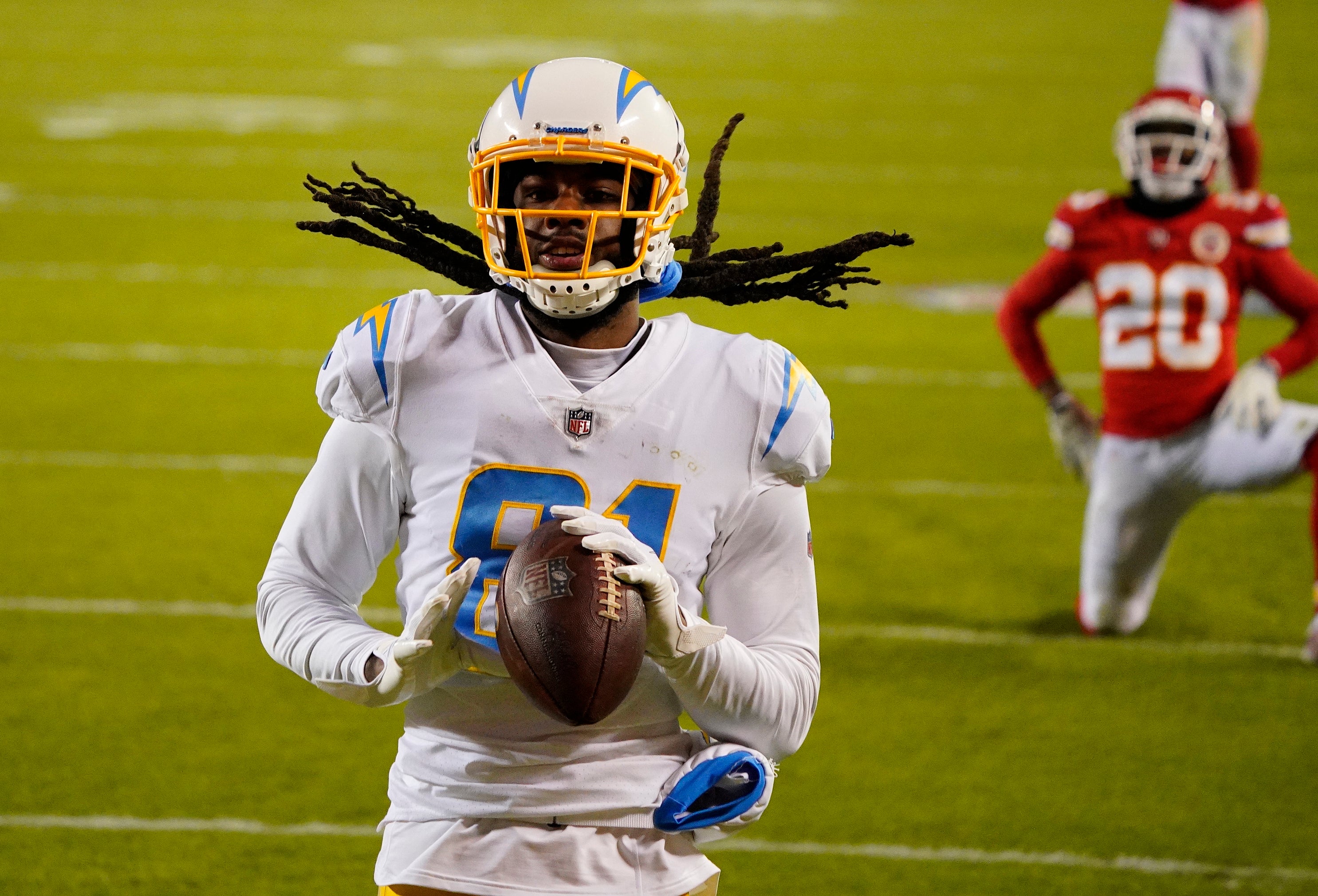 Jan 3, 2021; Kansas City, Missouri, USA; Los Angeles Chargers wide receiver Mike Williams (81) reacts after catching a pass for a touchdown against Kansas City Chiefs cornerback Antonio Hamilton (20) during the second half at Arrowhead Stadium.
