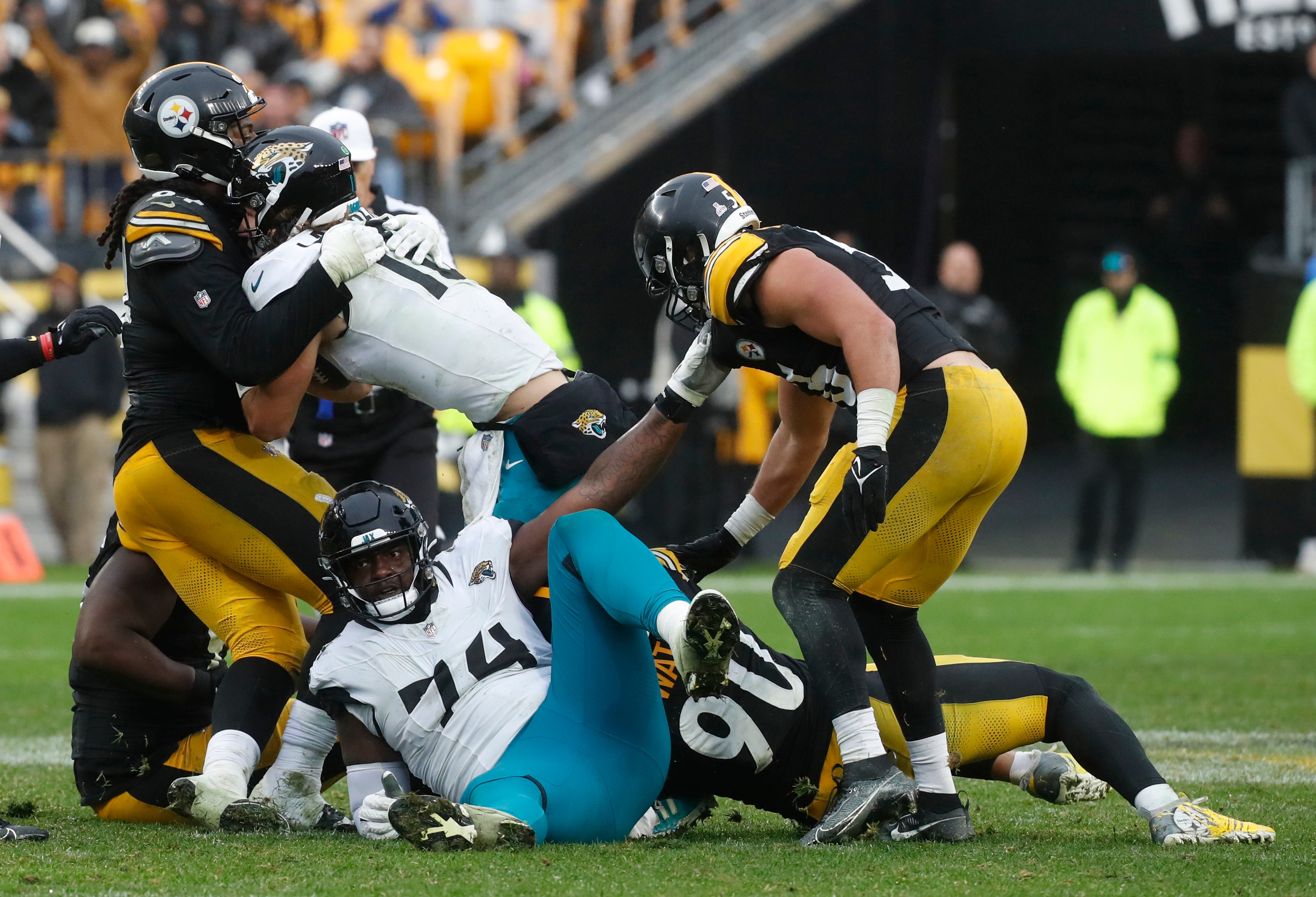 Oct 29, 2023; Pittsburgh, Pennsylvania, USA; Pittsburgh Steelers defensive tackle Armon Watts (94) and linebacker T.J. Watt (90) sack Jacksonville Jaguars quarterback Trevor Lawrence (16) during the fourth quarter at Acrisure Stadium. Mandatory Credit: Charles LeClaire-USA TODAY Sports