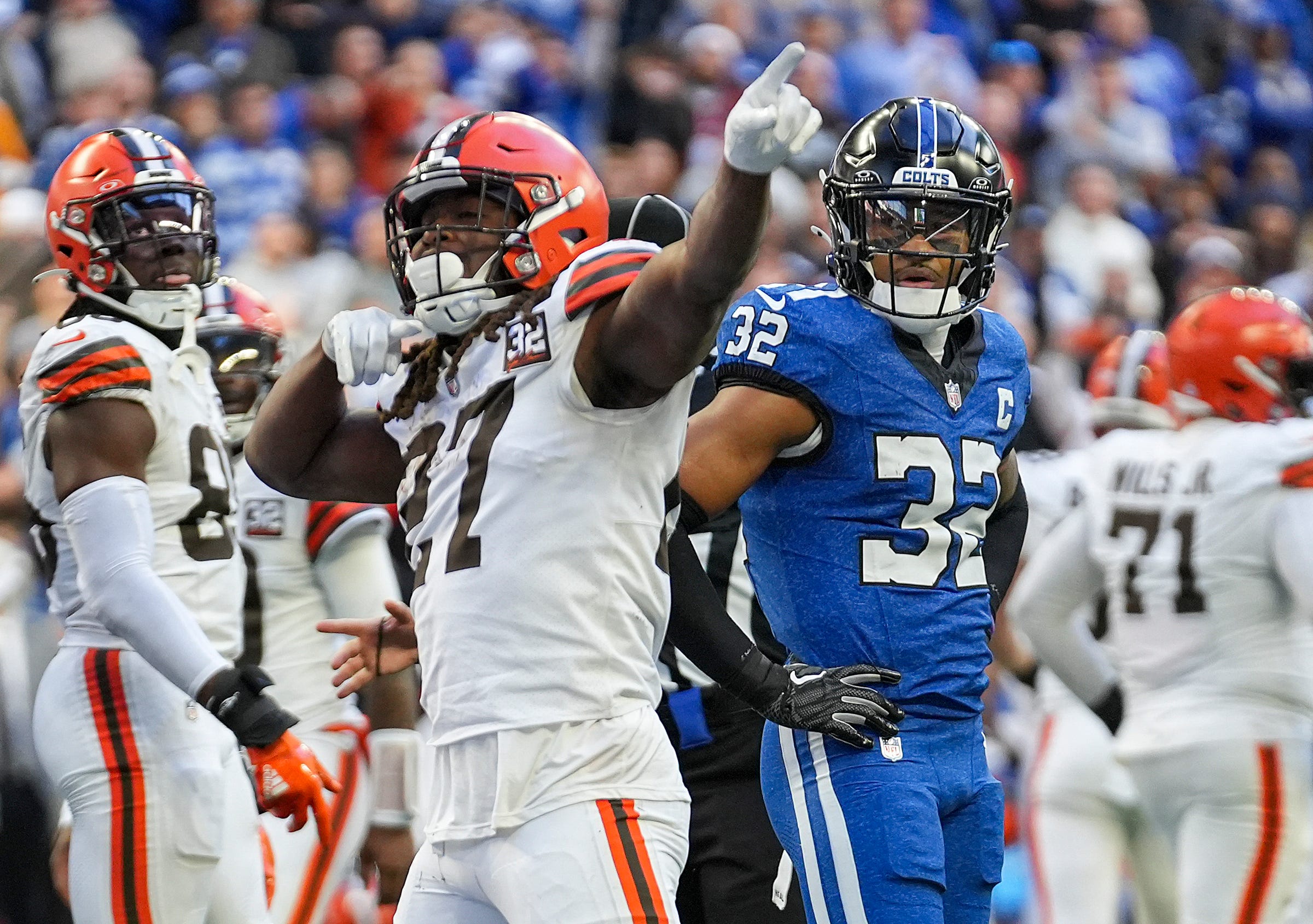 Cleveland Browns running back Kareem Hunt (27) celebrates as Indianapolis Colts safety Julian Blackmon (32) shows dejection after the Browns scored a touchdown late in the second half of the game Sunday, Oct. 22, 2023, at Lucas Oil Stadium in Indianapolis. The Browns defeated the Colts, 39-38.