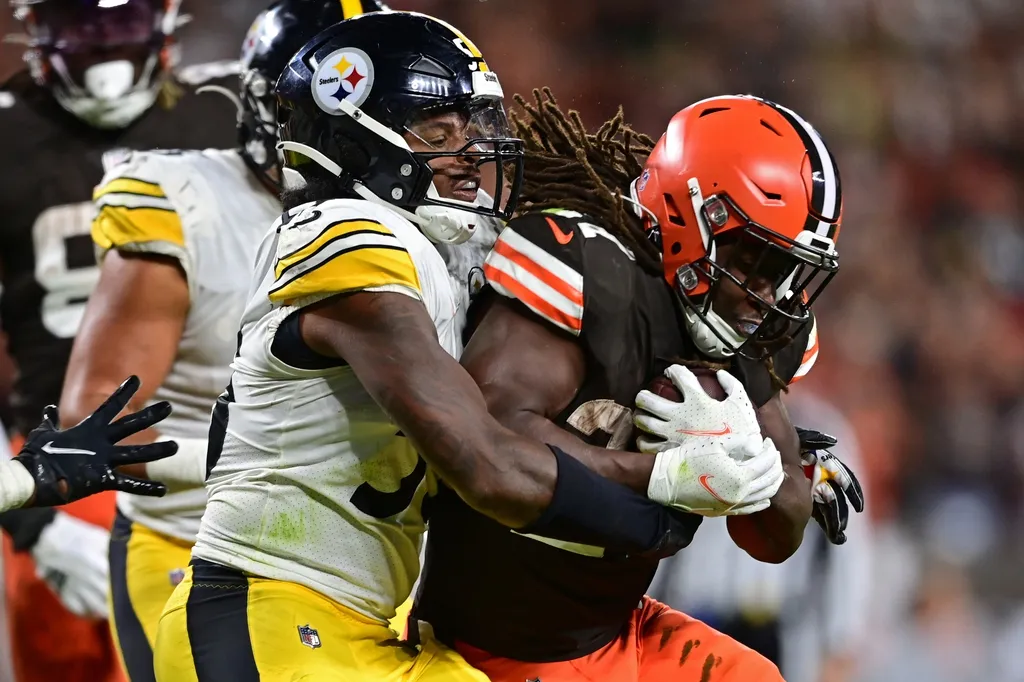 Cleveland Browns running back Kareem Hunt (27) is tackled by Pittsburgh Steelers linebacker Devin Bush (55) during the fourth quarter at FirstEnergy Stadium.