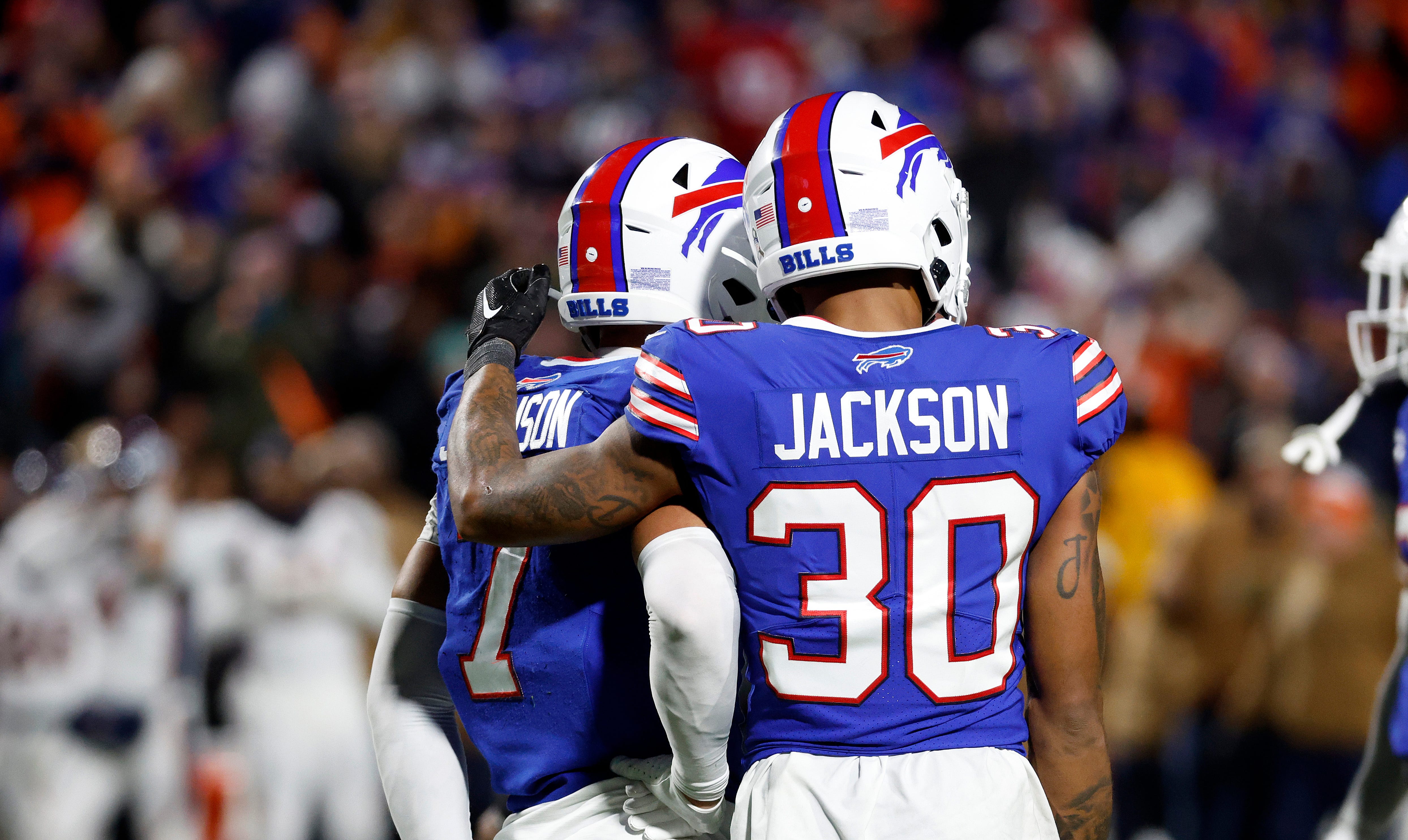 Dane Jackson, right, consoles Taron Johnson after the Buffalo Bills' 24-22 loss to the Denver Broncos.