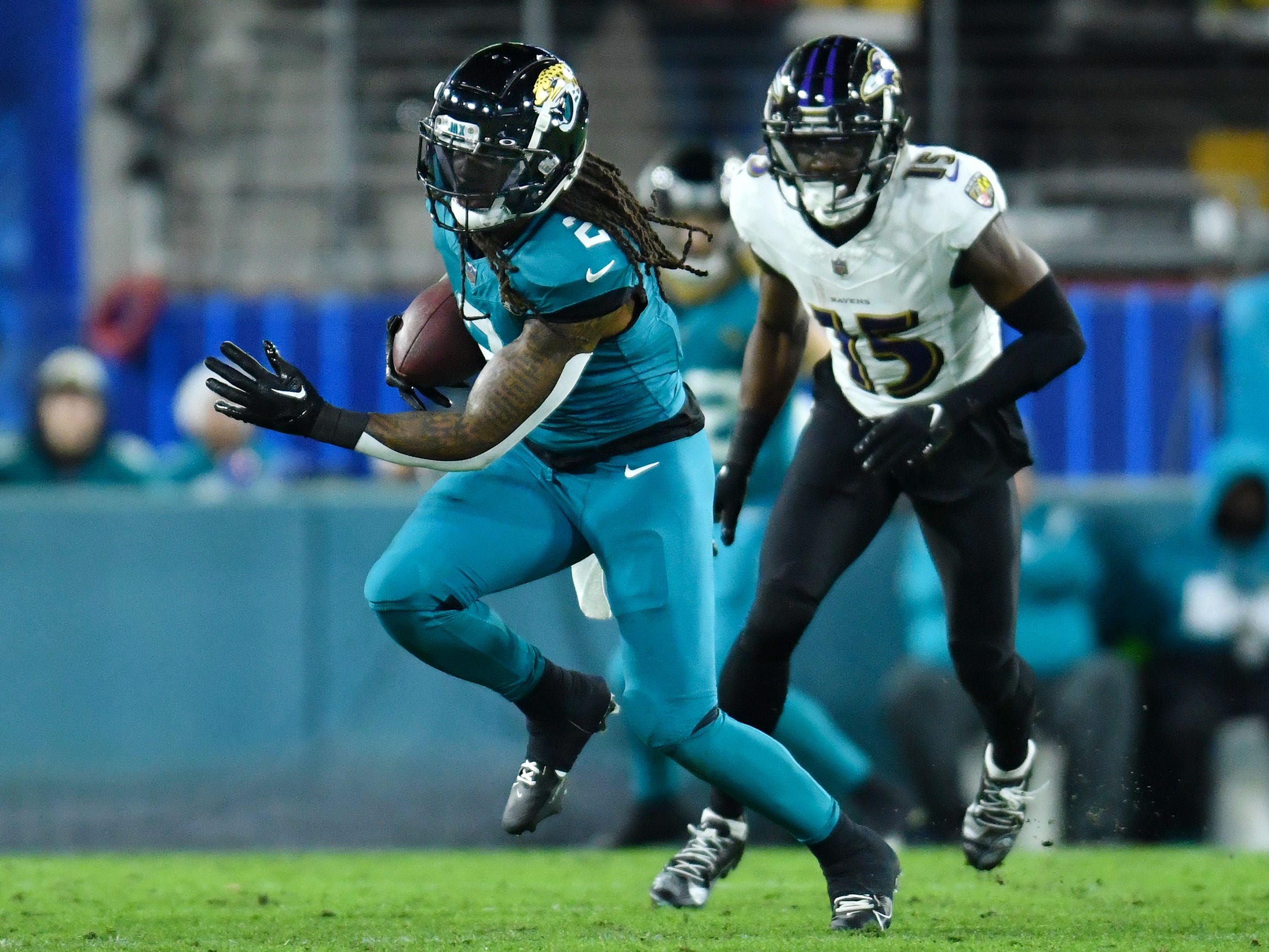 Jacksonville Jaguars safety Rayshawn Jenkins (2) runs back an intercepted early second quarter pass intended for Baltimore Ravens wide receiver Nelson Agholor (15). The Jacksonville Jaguars hosted the Baltimore Ravens at EverBank Stadium in Jacksonville, Florida Sunday Night, December 17, 2023.