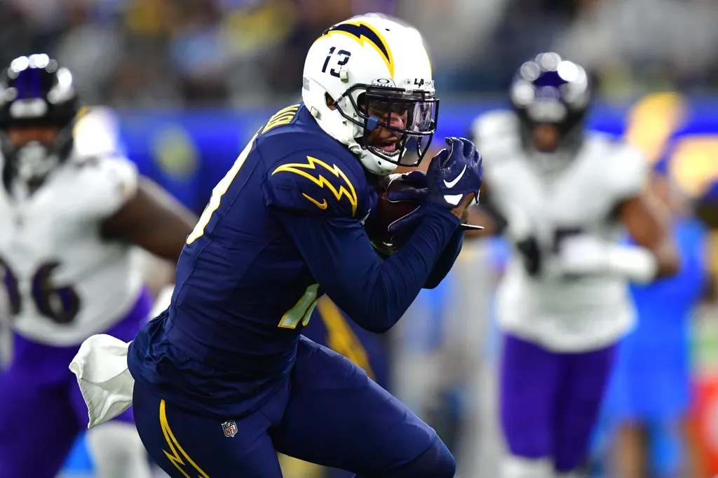 Los Angeles Chargers wide receiver Keenan Allen (13) runs the ball against the against the Baltimore Ravens during the first half at SoFi Stadium.