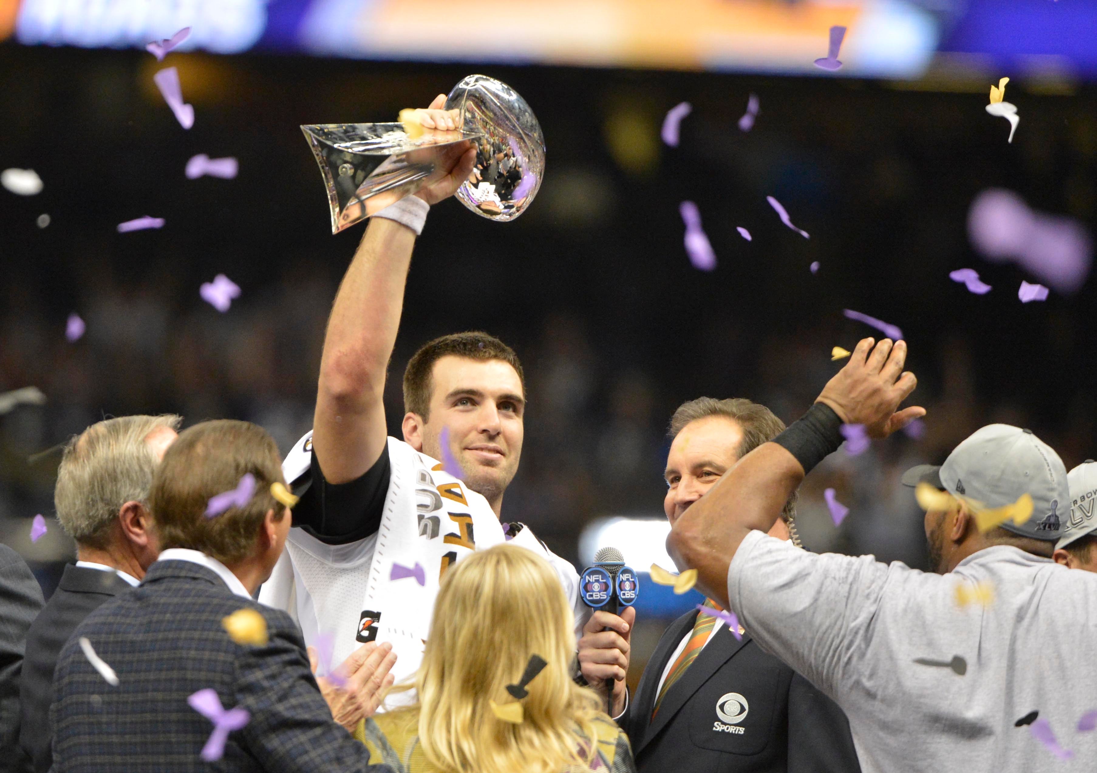 Feb 3, 2013; New Orleans, LA, USA; Baltimore Ravens quarterback Joe Flacco (5) holds the Vince Lombardi Trophy after winning Super Bowl XLVII against the San Francisco 49ers at the Mercedes-Benz Superdome.