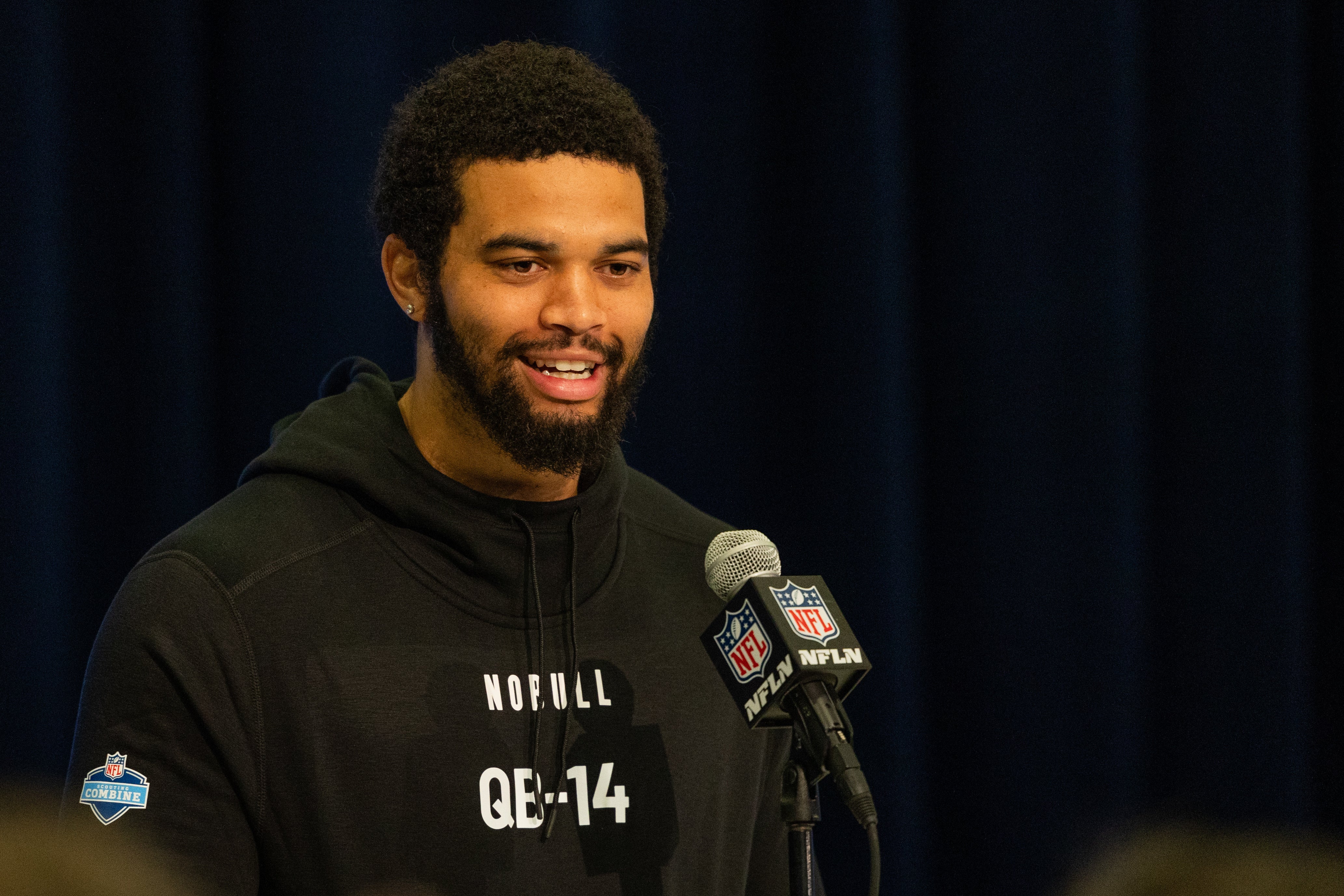 Mar 1, 2024; Indianapolis, IN, USA; Southern California quarterback Caleb Williams (QB14) talks to the media during the 2024 NFL Combine at Lucas Oil Stadium.