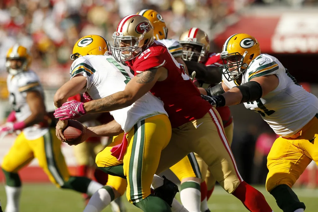 San Francisco 49ers outside linebacker Aaron Lynch (59) sacks Green Bay Packers quarterback Aaron Rodgers (12) in the fourth quarter at Levi's Stadium. The Packers defeated the 49ers 17-3.