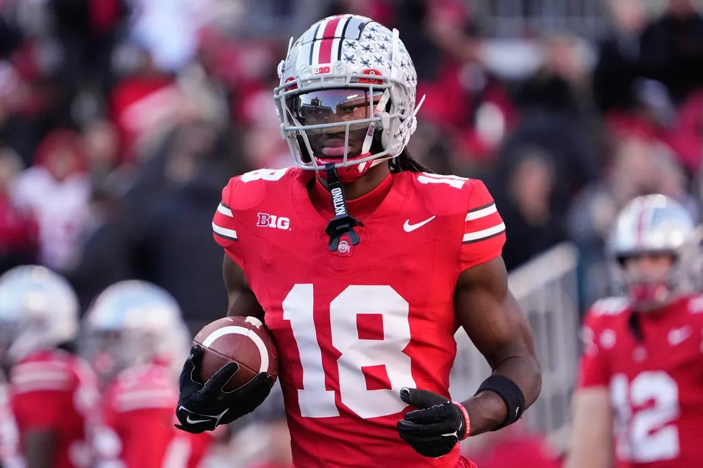 Ohio State Buckeyes wide receiver Marvin Harrison Jr. (18) warms up prior to the NCAA football game against the Minnesota Golden Gophers at Ohio Stadium
