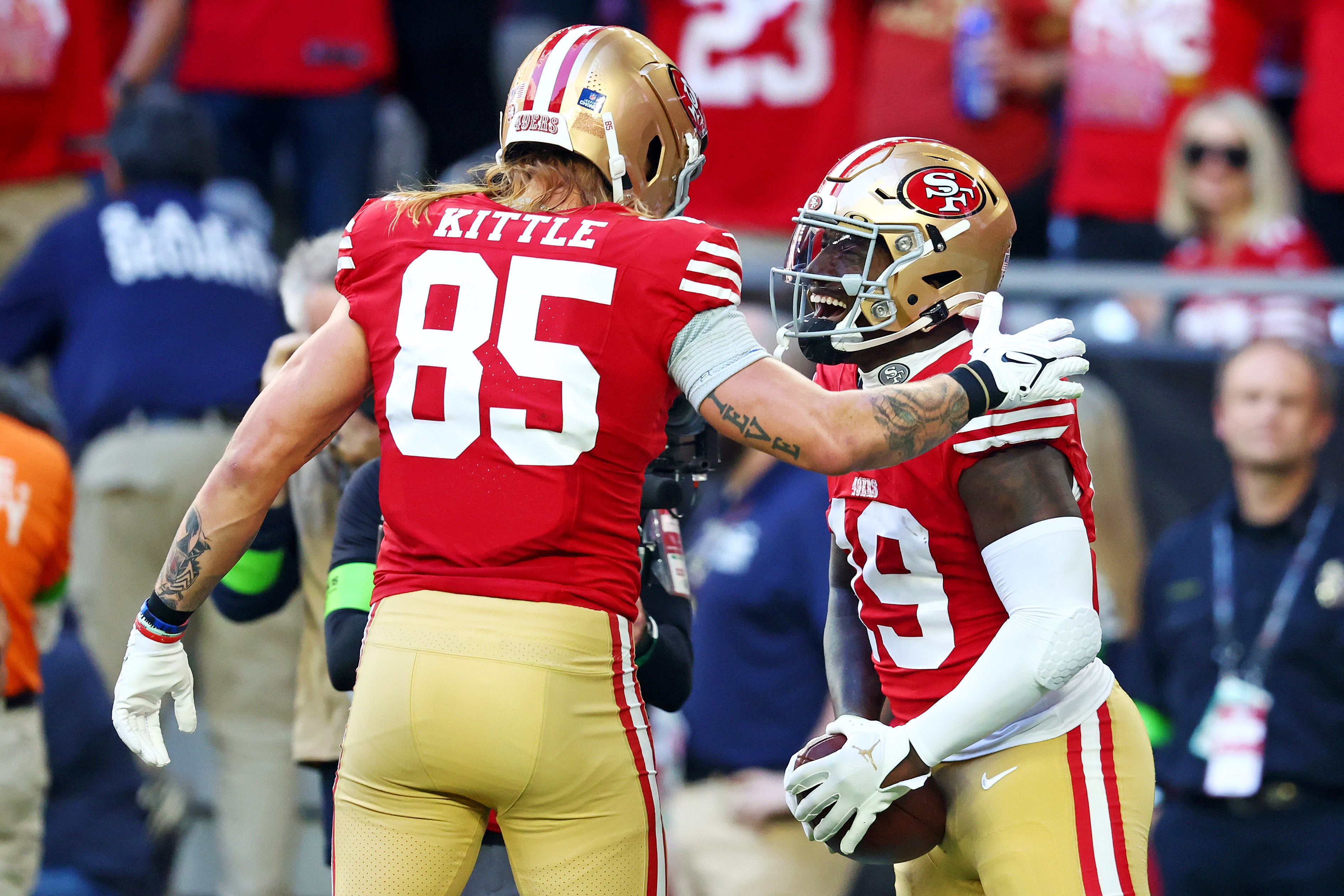 Dec 17, 2023; Glendale, Arizona, USA; San Francisco 49ers wide receiver Deebo Samuel (19) celebrates with San Francisco 49ers tight end George Kittle (85) after scoring a touchdown during the first quarter against the Arizona Cardinals at State Farm Stadium.