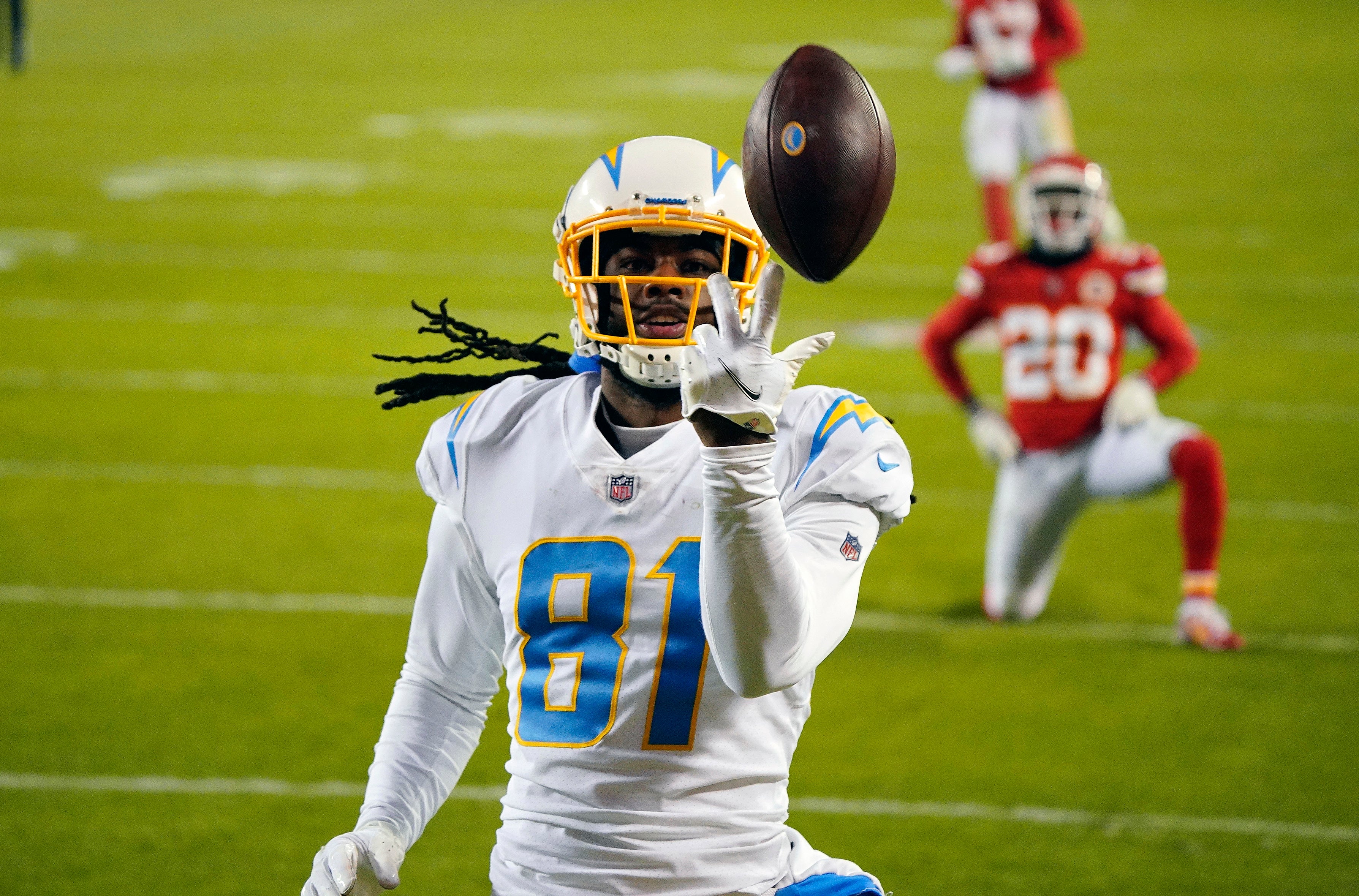 Jan 3, 2021; Kansas City, Missouri, USA; Los Angeles Chargers wide receiver Mike Williams (81) reacts after catching a pass for a touchdown against Kansas City Chiefs cornerback Antonio Hamilton (20) during the second half at Arrowhead Stadium.