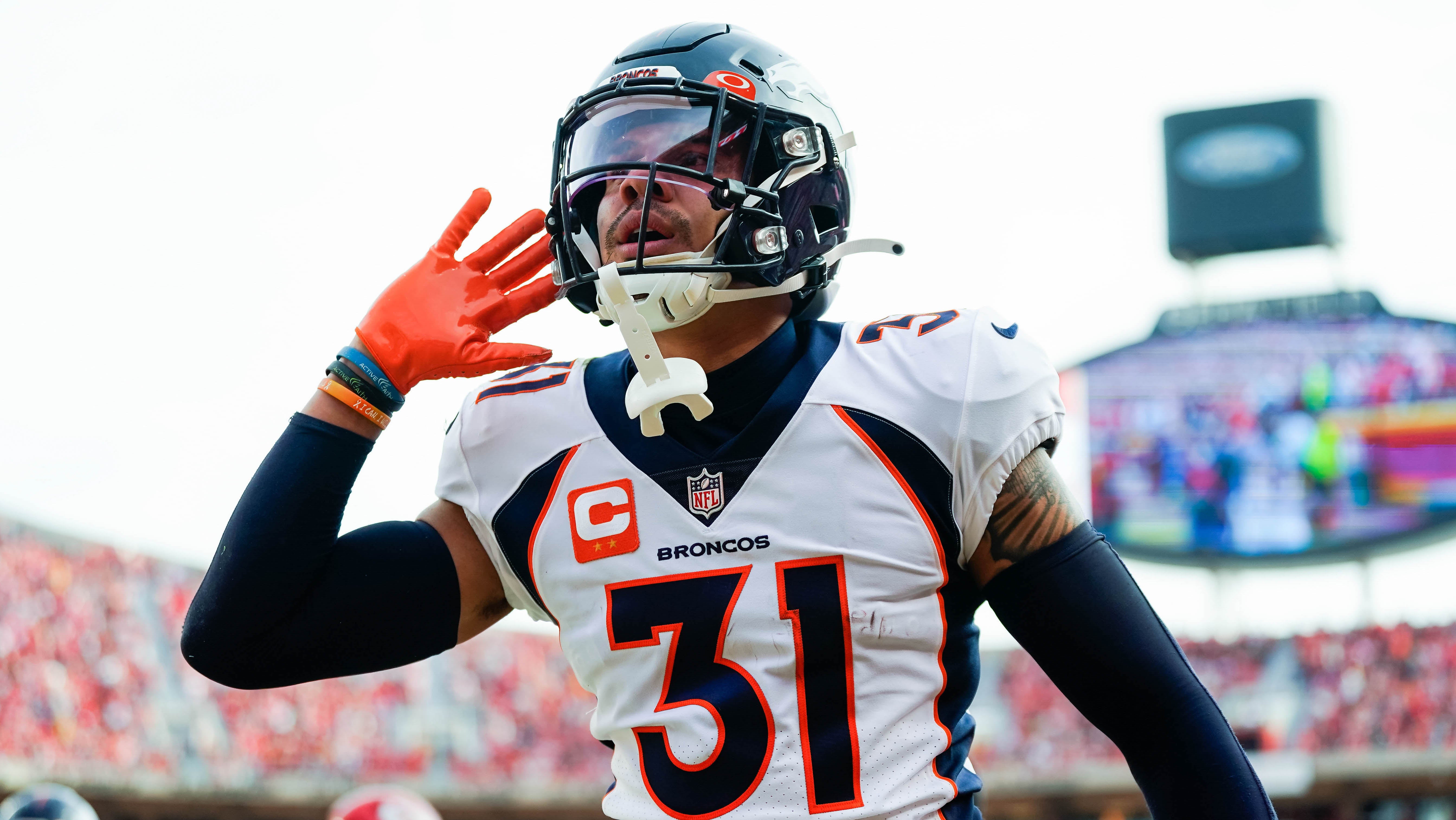Denver Broncos safety Justin Simmons (31) celebrates after an interception during the first half against the Kansas City Chiefs at GEHA Field at Arrowhead Stadium. Jay Biggerstaff-USA TODAY Sports