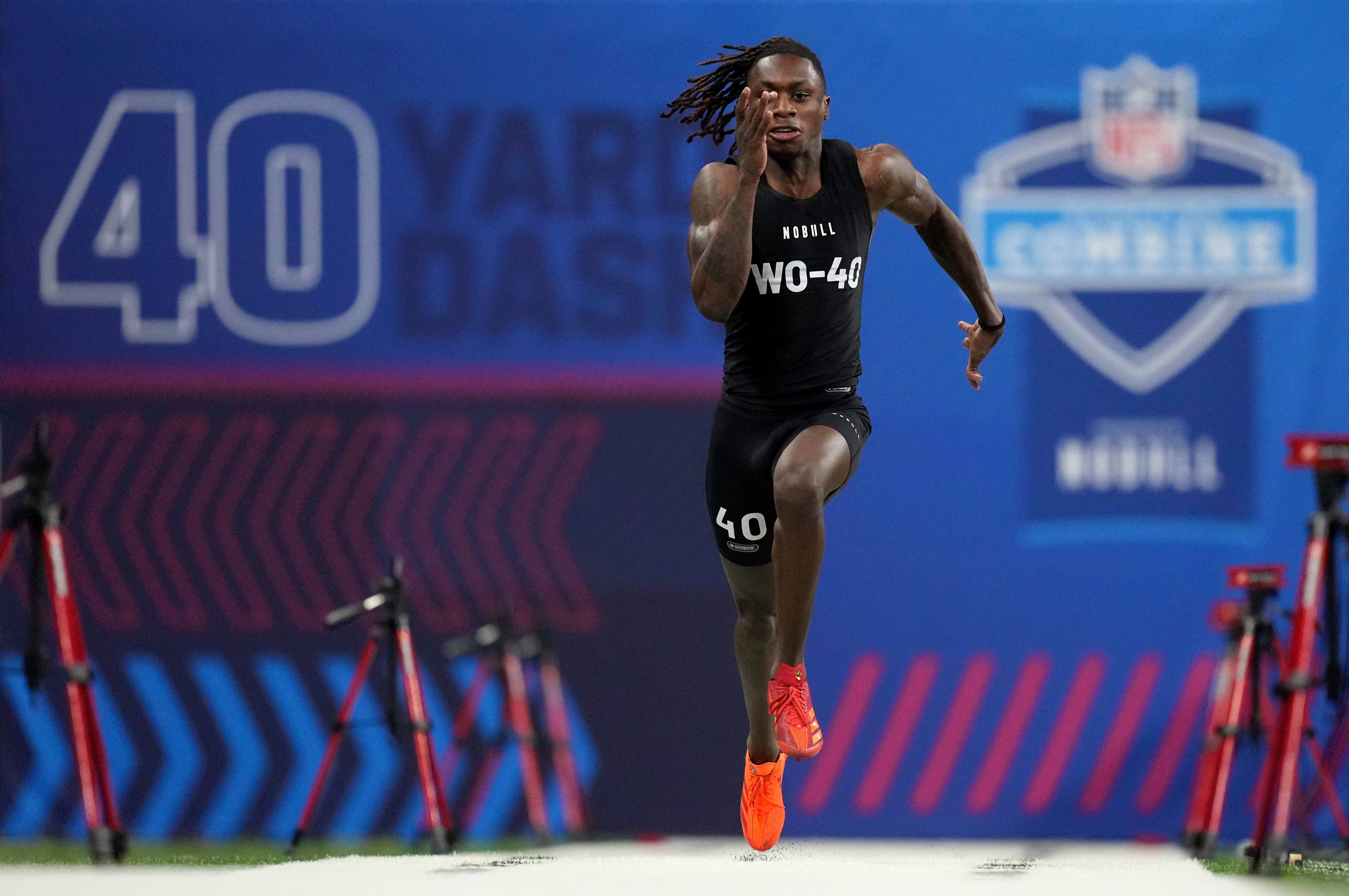 Mar 2, 2024; Indianapolis, IN, USA; Texas wide receiver Xavier Worthy (WO40) ran an official time of 4.21 seconds to set a combine record during the 2024 NFL Combine at Lucas Oil Stadium.