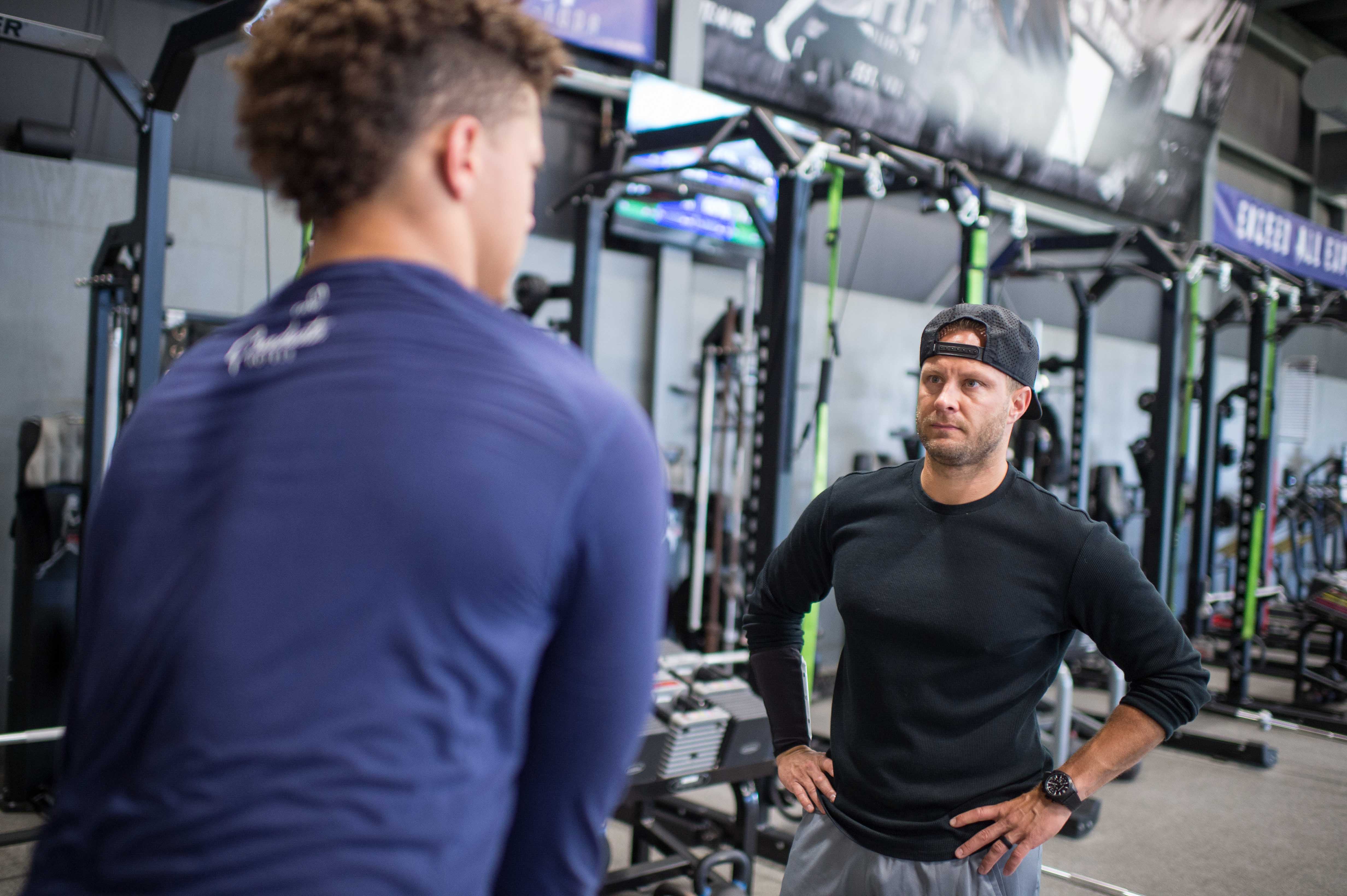Apr 24, 2017; Tyler, TX, USA; Patrick Mahomes (left), quarterback from the Texas Tech Red Raiders, trains at the APEC training facility in Tyler, TX with facility owner Bobby Stroupe (right).