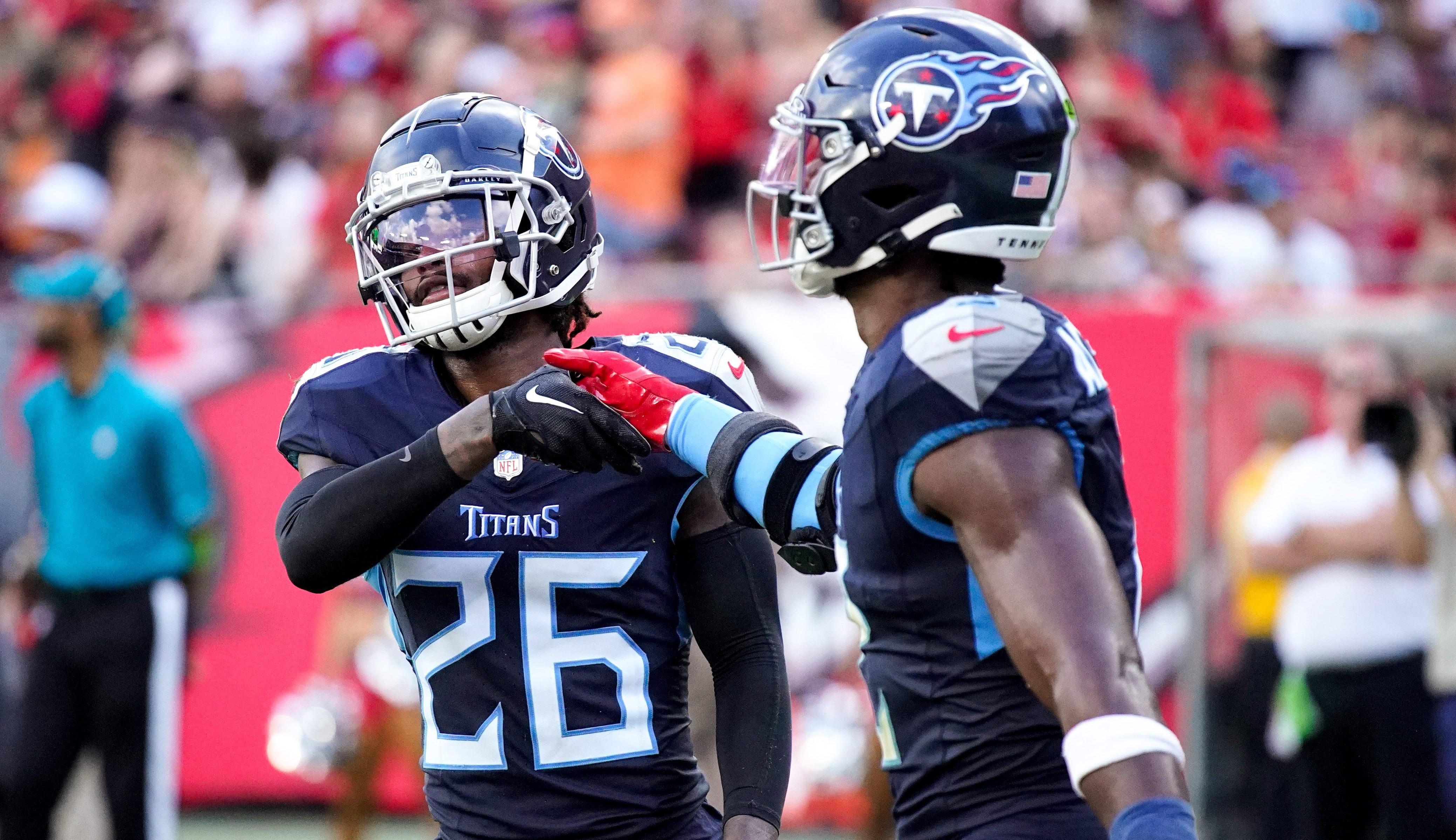 Tennessee Titans cornerback Kristian Fulton (26) and linebacker Azeez Al-Shaair (2) celebrate breaking up a Tampa Bay Buccaneers pass during the third quarter at Raymond James Stadium in Tampa, Fla., ... Denny Simmons / The Tennessean-USA TODAY NETWORK