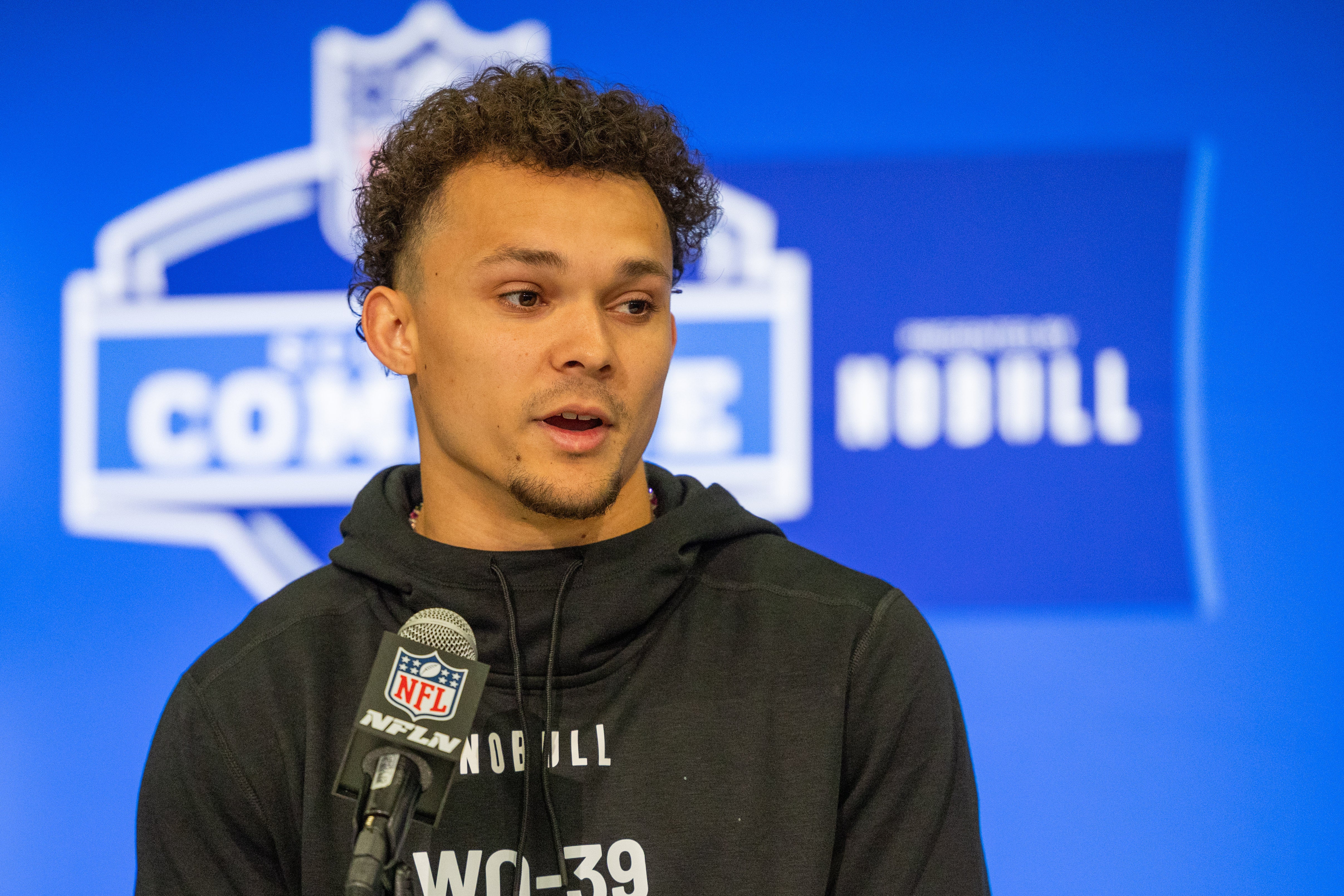 Mar 1, 2024; Indianapolis, IN, USA; Michigan wide receiver Roman Wilson (WO39) talks to the media during the 2024 NFL Combine at Lucas Oil Stadium.