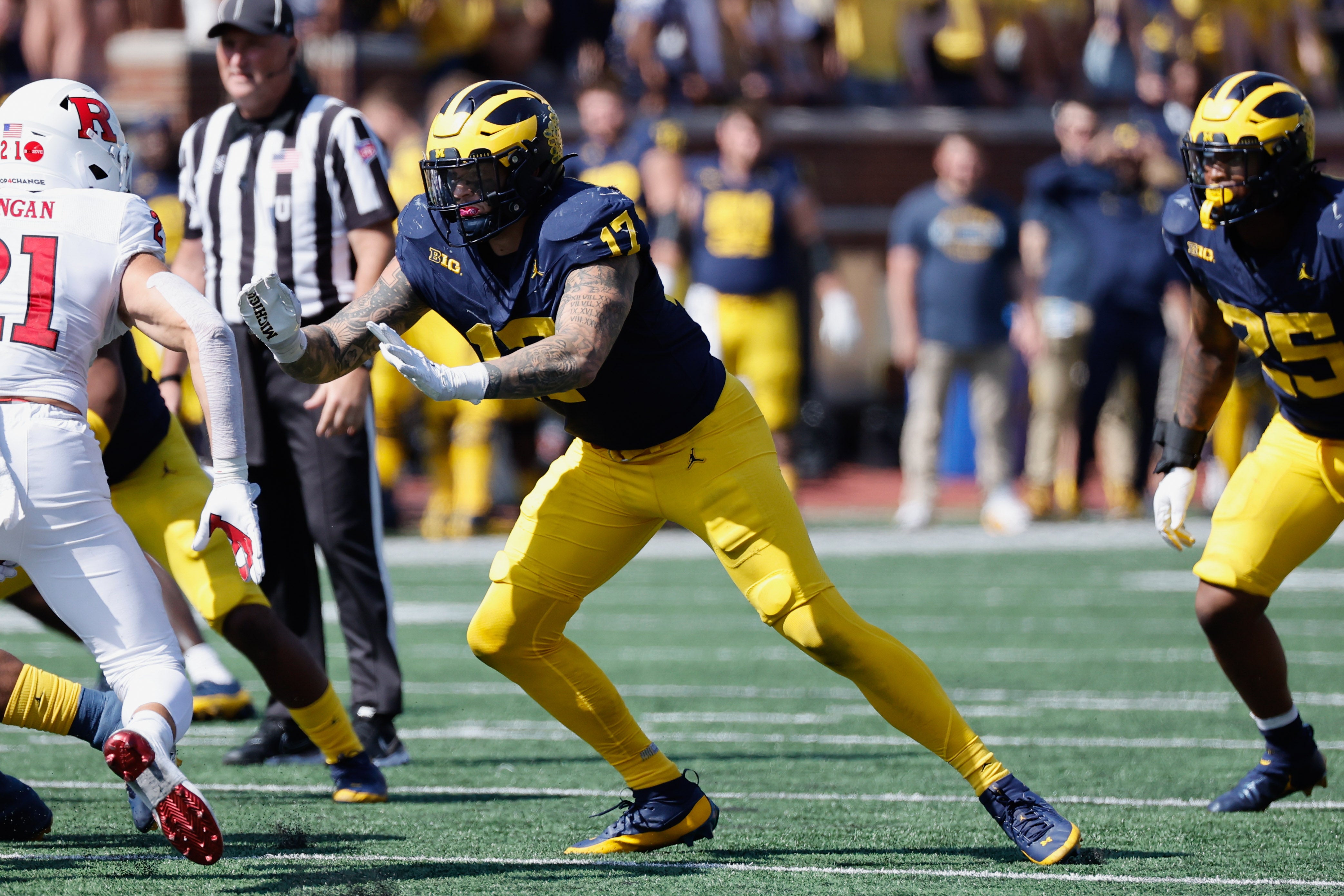 Sep 23, 2023; Ann Arbor, Michigan, USA; Michigan Wolverines defensive end Braiden McGregor (17) rushes on defense against the Rutgers Scarlet Knights at Michigan Stadium.
