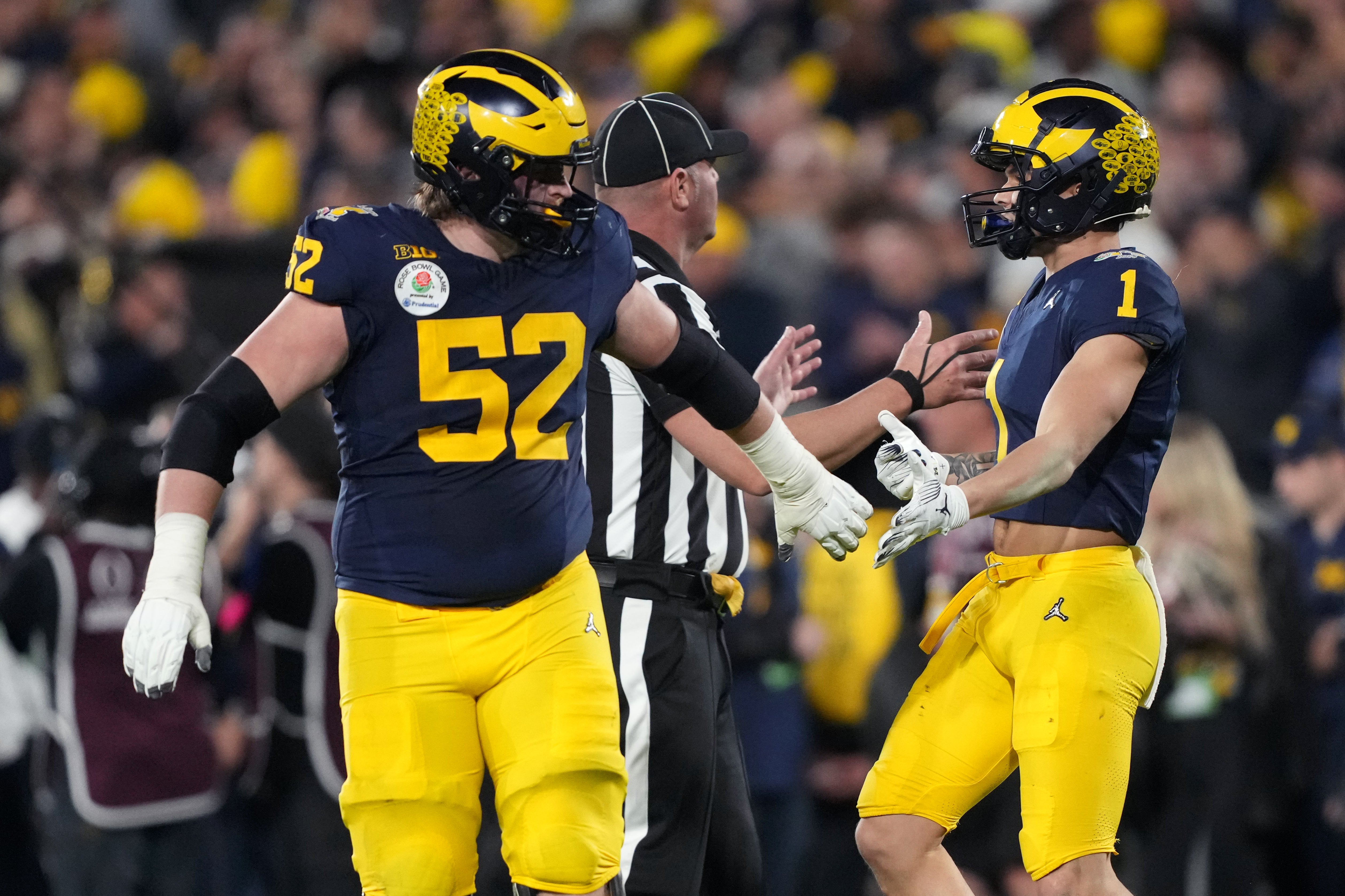 Jan 1, 2024; Pasadena, CA, USA; Michigan Wolverines wide receiver Roman Wilson (1) celebrates with offensive lineman Karsen Barnhart (52) after scoring a touchdown against the Alabama Crimson Tide during the second half in the 2024 Rose Bowl college football playoff semifinal game at Rose Bowl. Mandatory Credit: Kirby Lee-USA TODAY Sports