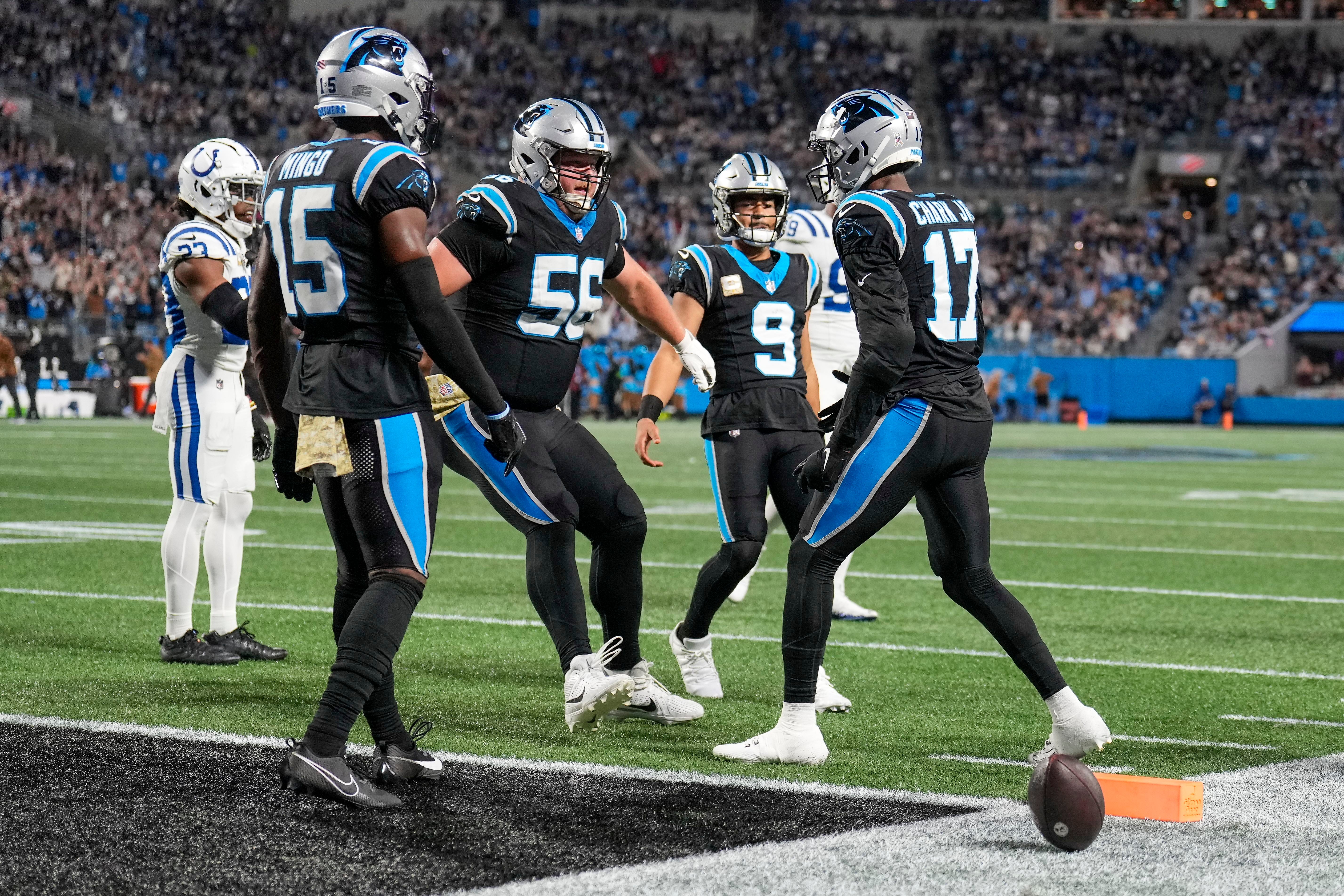 Nov 5, 2023; Charlotte, North Carolina, USA; Carolina Panthers center Bradley Bozeman (56) and teammates congratulate wide receiver DJ Chark Jr. (17) after his touchdown reception against the Indianapolis Colts during the third quarter at Bank of America Stadium. Mandatory Credit: Jim Dedmon-USA TODAY Sports