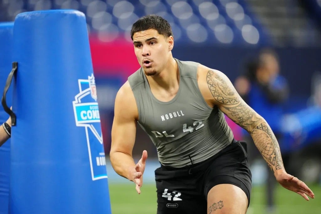 UCLA defensive lineman Laiatu Latu (DL42) works out during the 2024 NFL Combine at Lucas Oil Stadium.