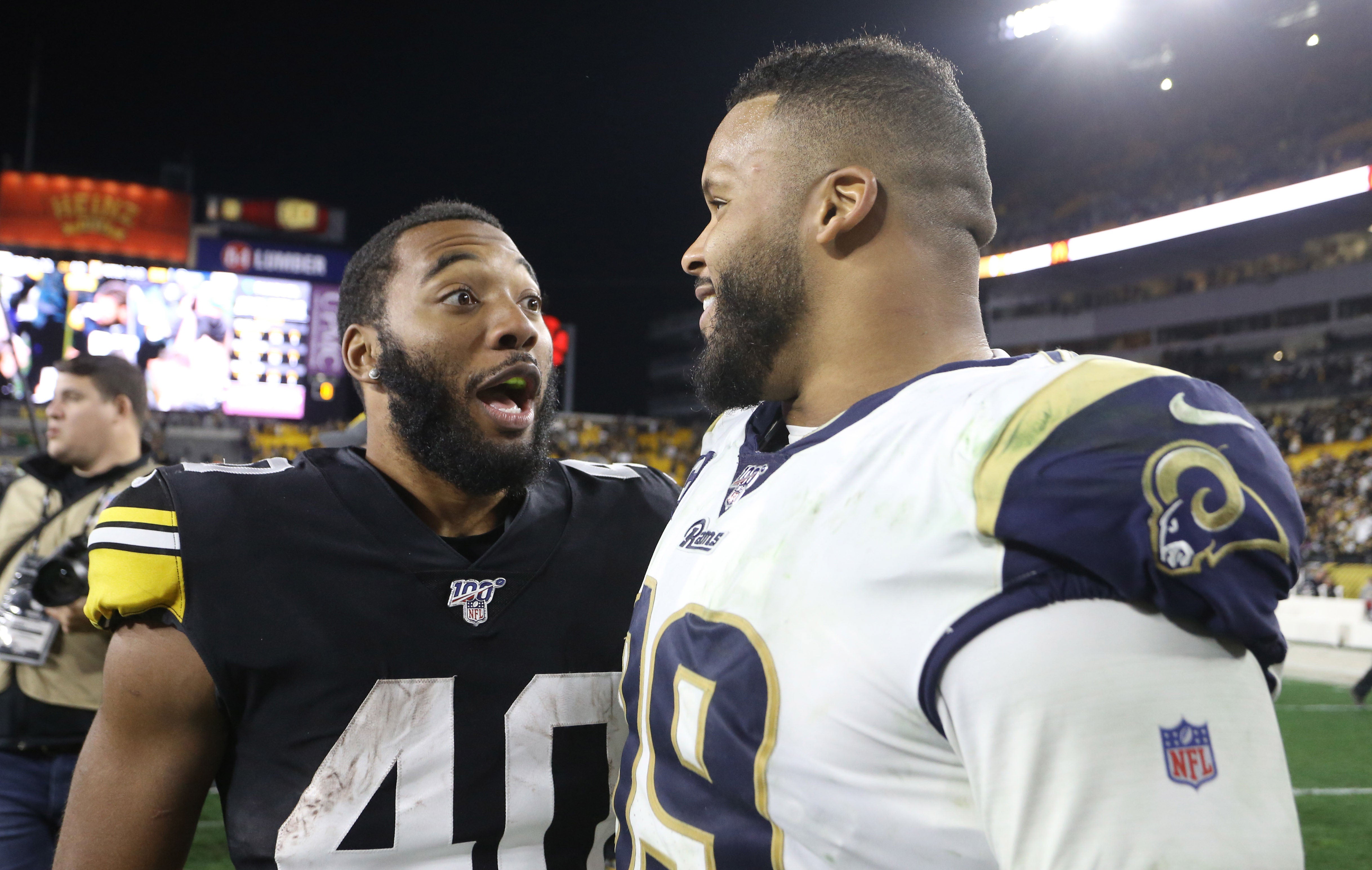 Nov 10, 2019; Pittsburgh, PA, USA; Pittsburgh Steelers running back Tony Brooks-James (40) and Los Angeles Rams defensive tackle Aaron Donald (99) talk after playing at Heinz Field. Pittsburgh won 17-12. Mandatory Credit: Charles LeClaire-USA TODAY Sports