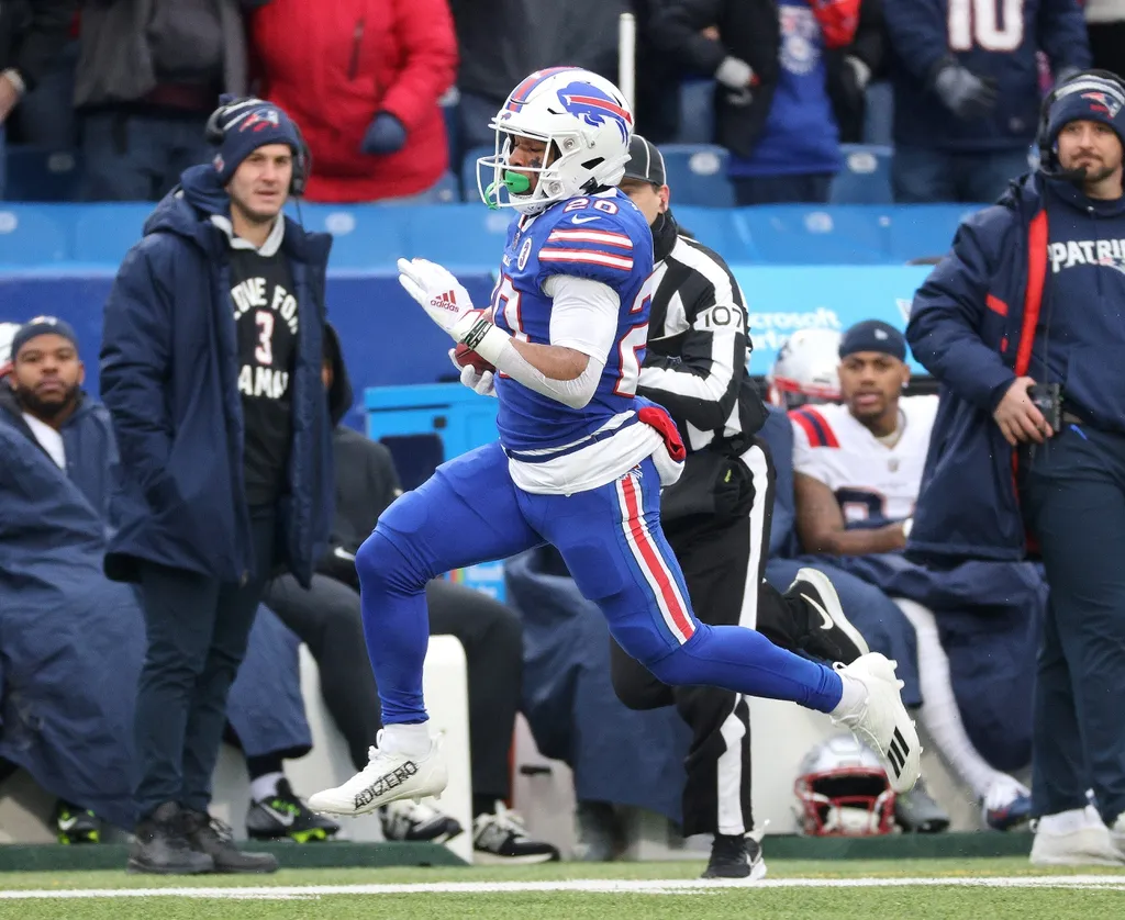 The Bills' Nyheim Hines returns the opening kickoff for a touchdown against the Patriots