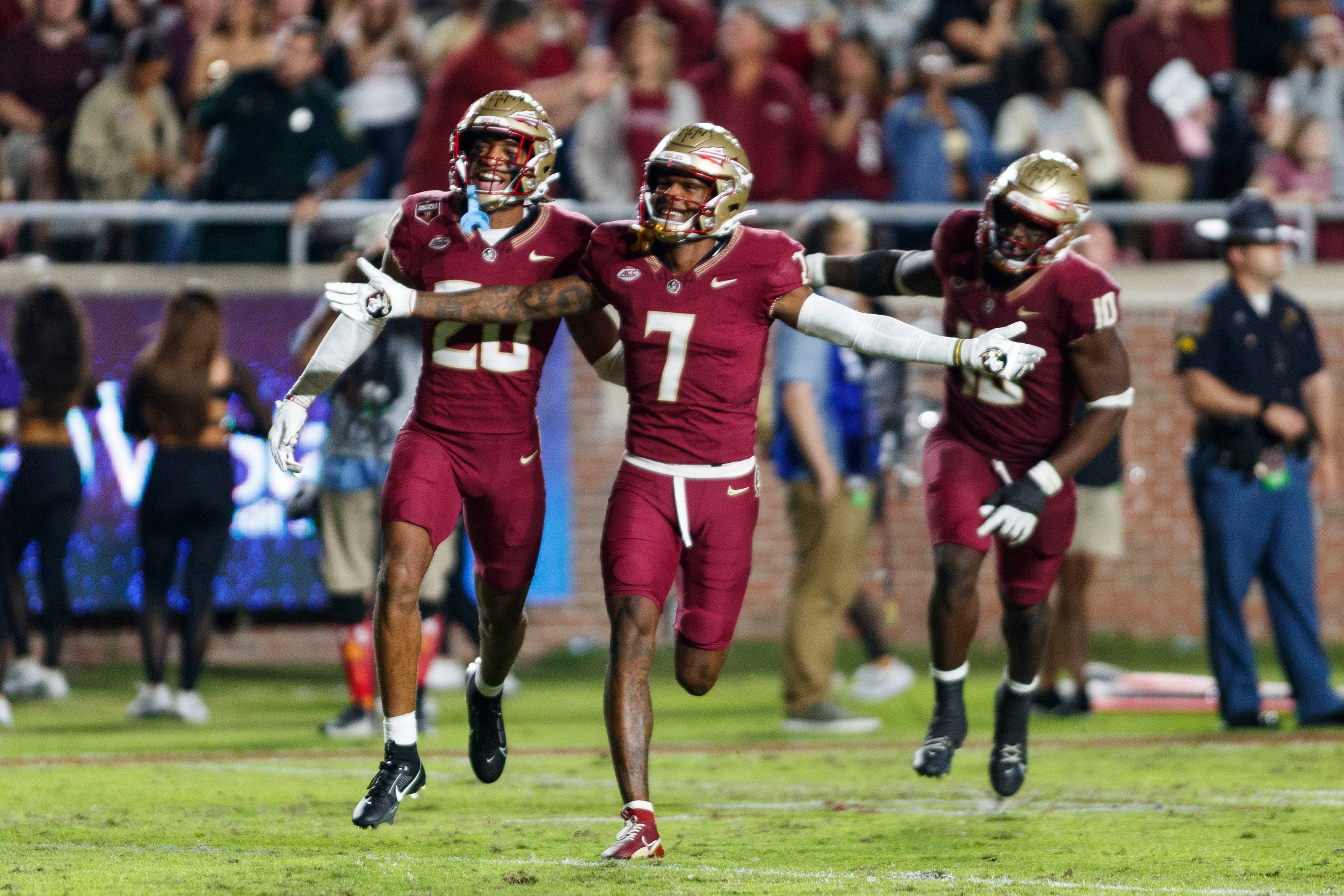 Nov 18, 2023; Tallahassee, Florida, USA; Florida State Seminoles defensive back Azareye'h Thomas (20) and defensive back Jarrian Jones (7) celebrate an interception against the North Alabama Lions during the third quarter at Doak S. Campbell Stadium.