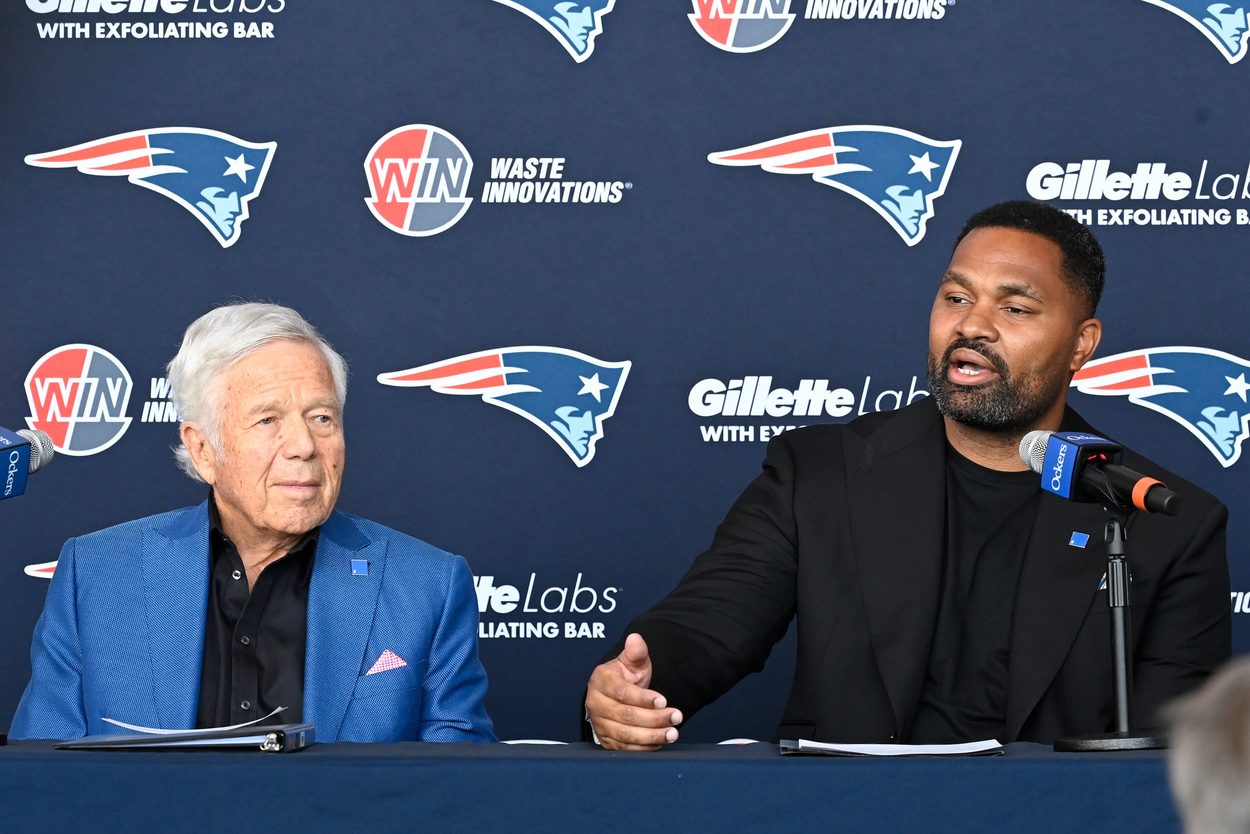Caption: Jan 17, 2024; Foxborough, MA, USA; New England Patriots head coach Jerod Mayo (R) addresses media with owner Robert Kraft (L) at a press conference at Gillette Stadium.