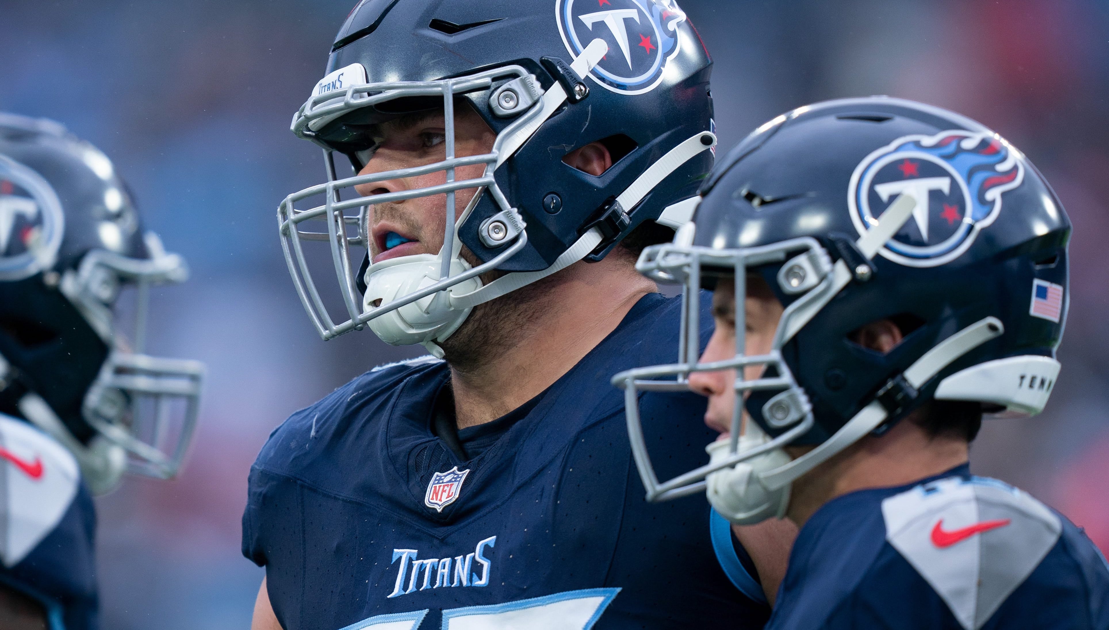 Tennessee Titans offensive tackle Peter Skoronski (77) huddles with his team during their game against the Carolina Panthers at Nissan Stadium in Nashville, Tenn., Sunday, Nov. 26, 2023 Denny Simmons / The Tennessean-USA TODAY NETWORK