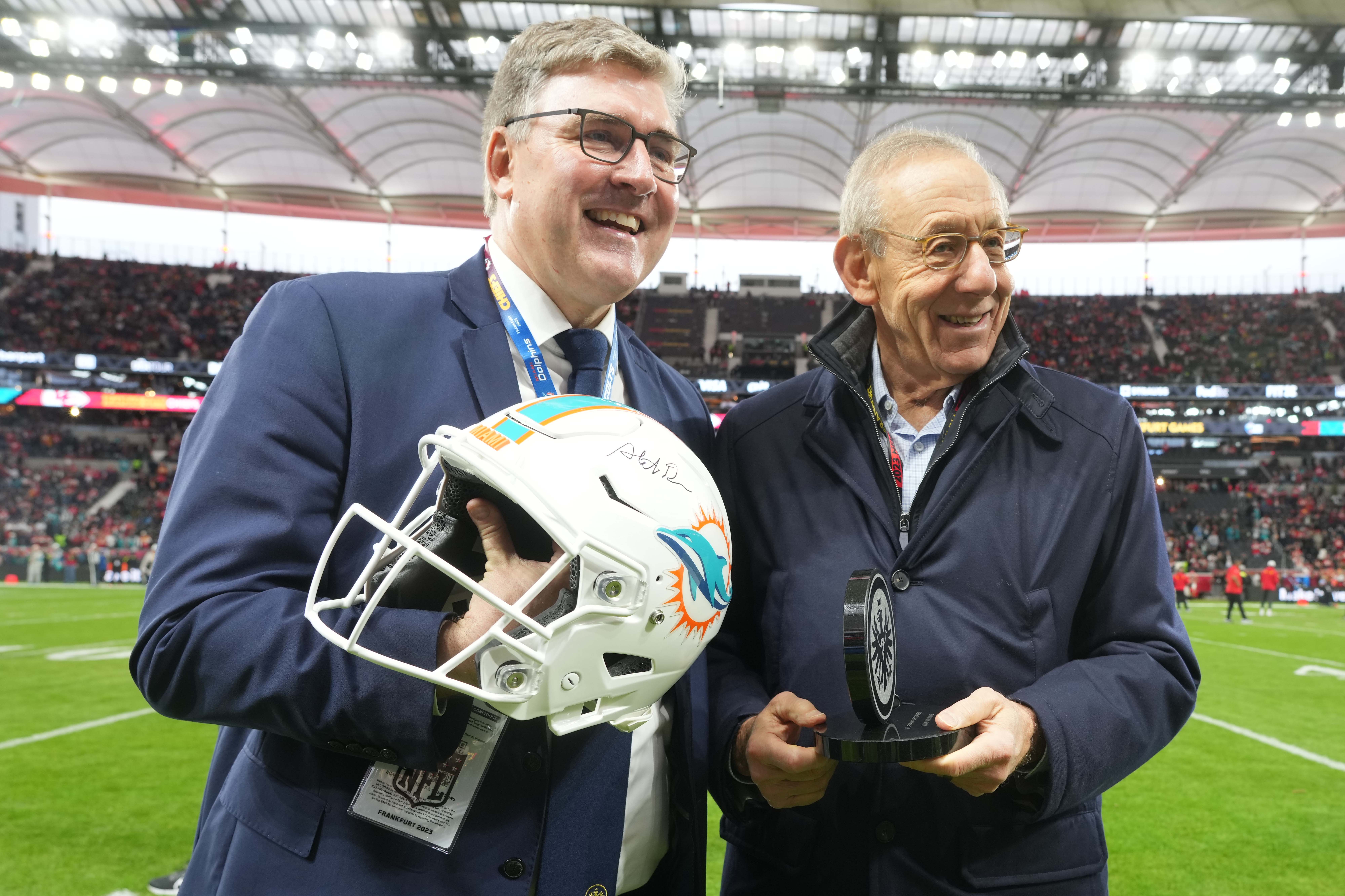 Nov 5, 2023; Frankfurt, Germany; Miami Dolphins owner Stephen Ross (right) poses with Eintracht Frankfurt Football AG chief executive officer Axel Hellmann during an NFL International Series game at Deutsche Bank Park.