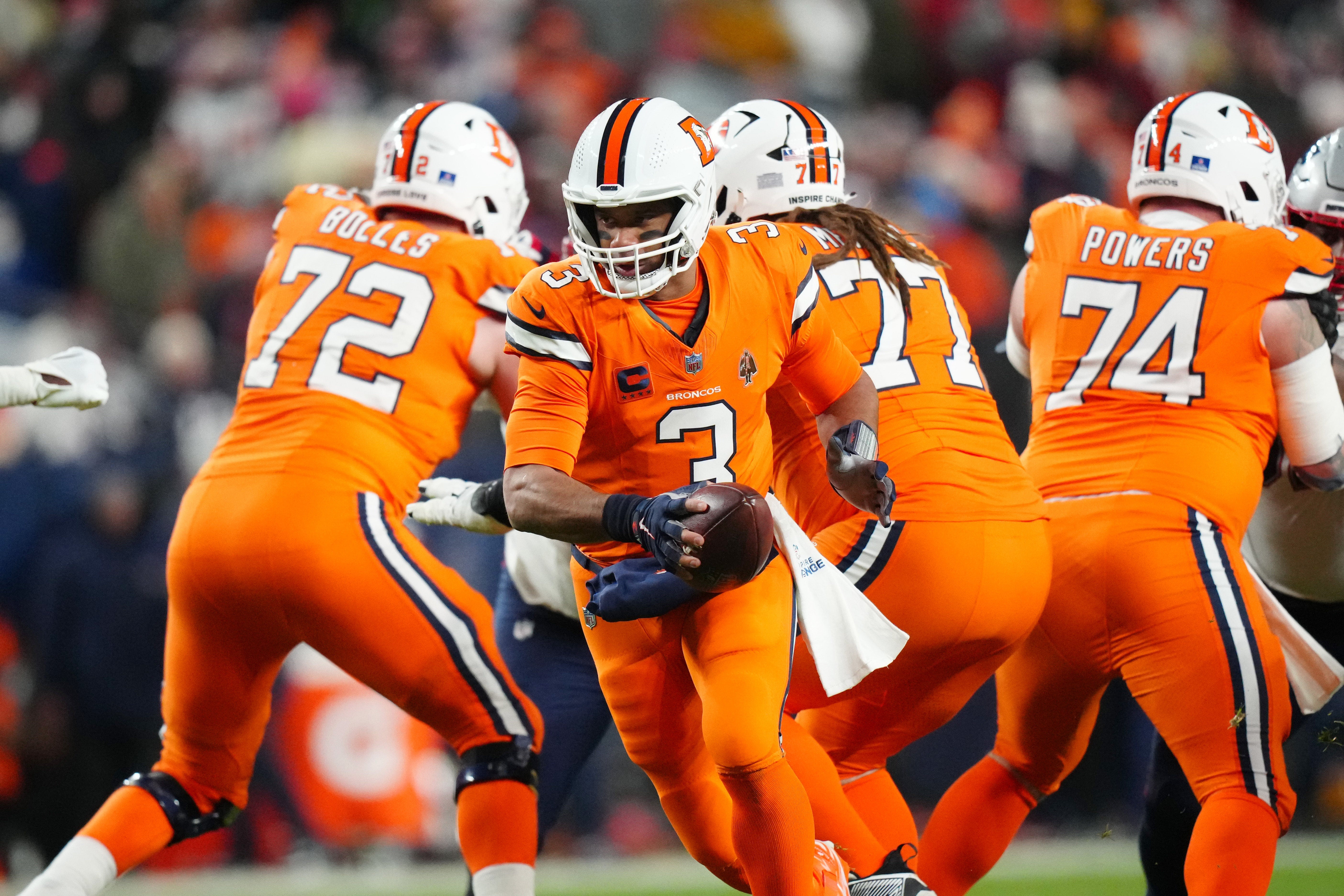 Dec 24, 2023; Denver, Colorado, USA; Denver Broncos quarterback Russell Wilson (3) during the first half against the New England Patriots at Empower Field at Mile High. Mandatory Credit: Ron Chenoy-USA TODAY Sports