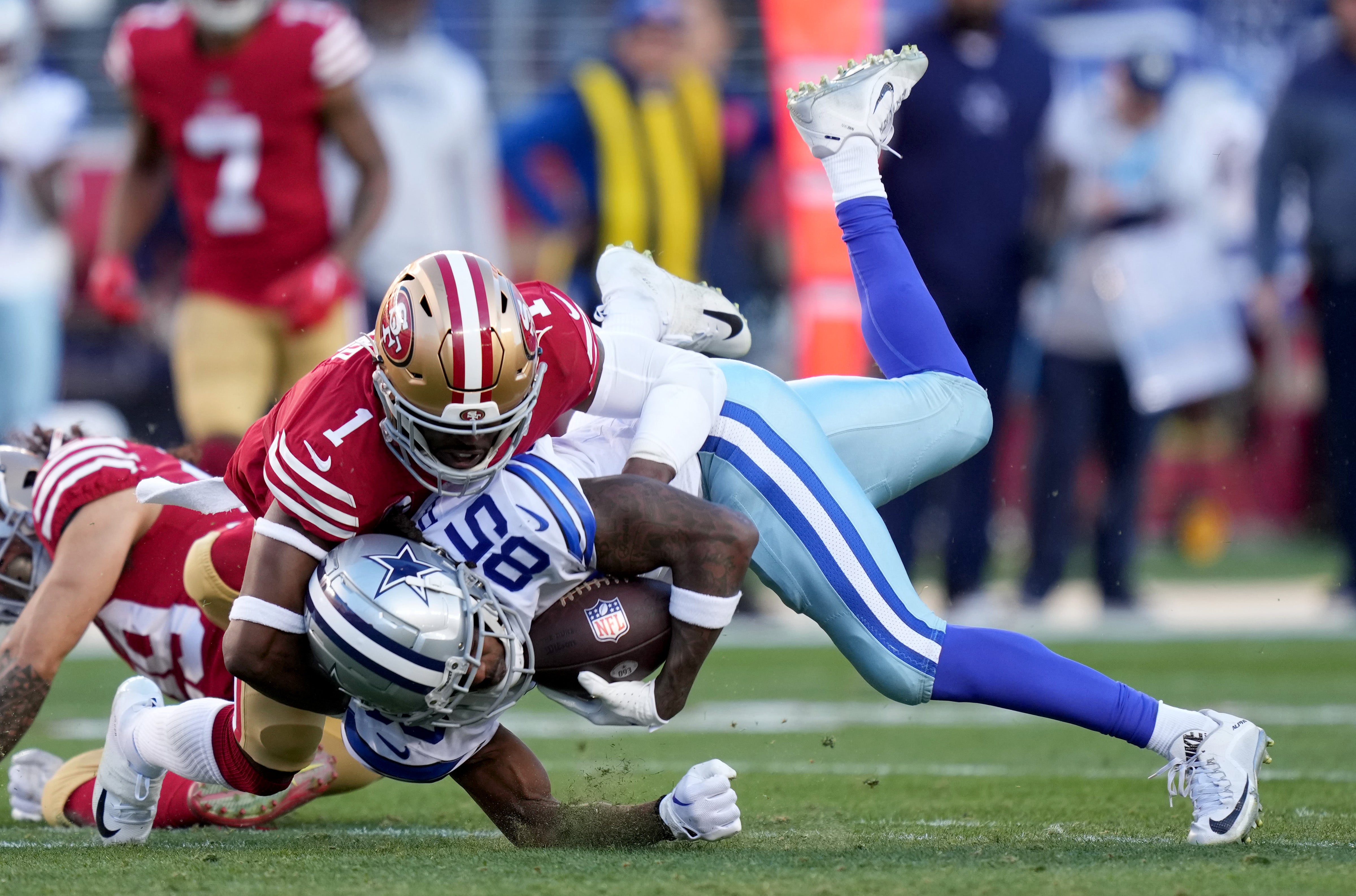 Jan 22, 2023; Santa Clara, California, USA; San Francisco 49ers cornerback Jimmie Ward (1) tackles Dallas Cowboys wide receiver Noah Brown (85) during the second quarter of a NFC divisional round game at Levi's Stadium.
