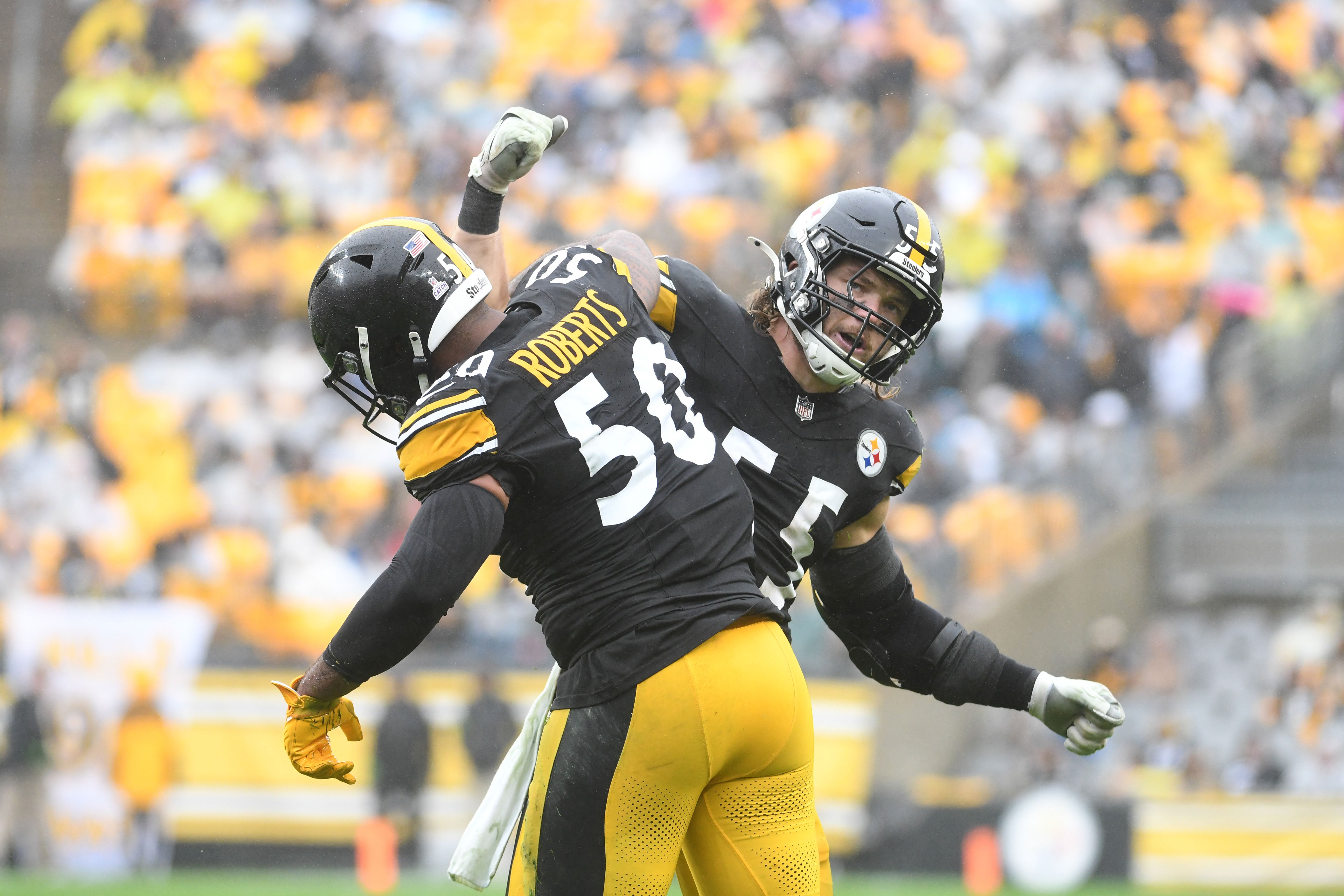 Oct 29, 2023; Pittsburgh, Pennsylvania, USA; Pittsburgh Steelers linebackers Cole Holcomb (55) and Elandon Roberts (50) celebrate a third down tackle against the Jacksonville Jaguars during the second quarter at Acrisure Stadium. Mandatory Credit: Philip G. Pavely-USA TODAY Sports