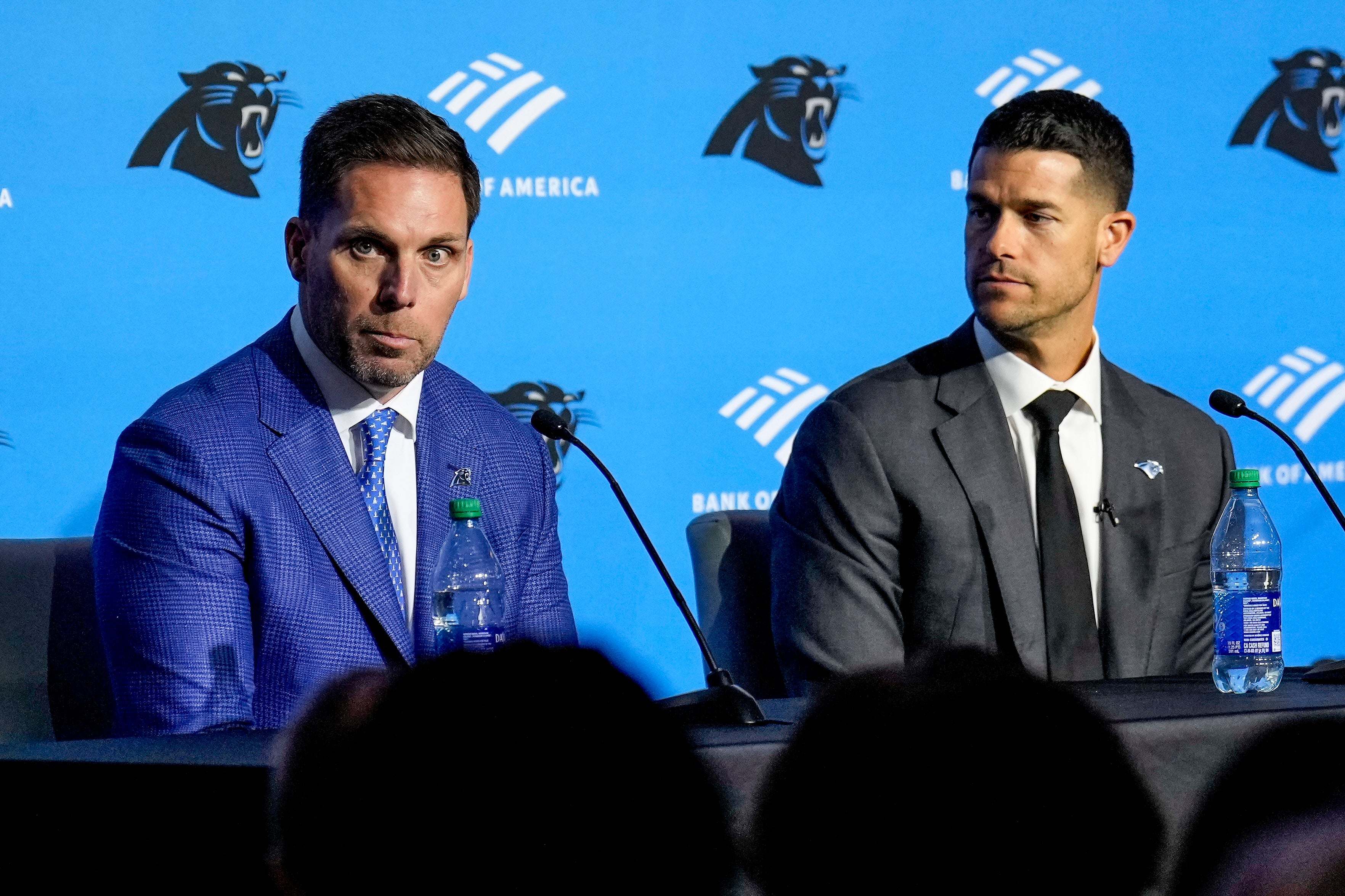 Feb 1, 2024; Charlotte, NC, USA; Carolina Panthers general manager Dan Morgan (left) speaks with new coach Dave Canales during the introductory press conference at Bank of America Stadium. Mandatory Credit: Jim Dedmon-USA TODAY Sports