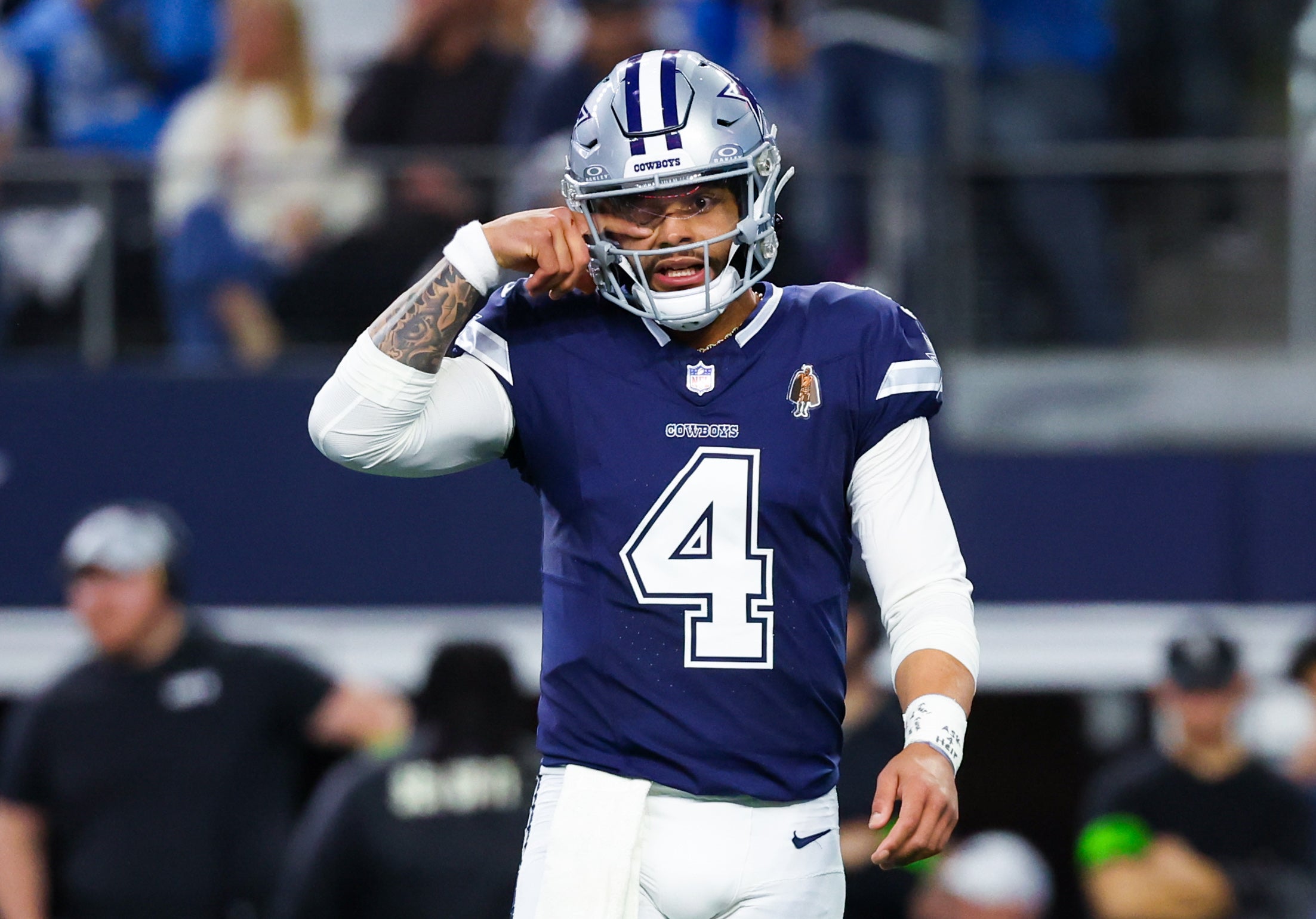 Dallas Cowboys quarterback Dak Prescott (4) reacts during the game against the Detroit Lions at AT&T Stadium.