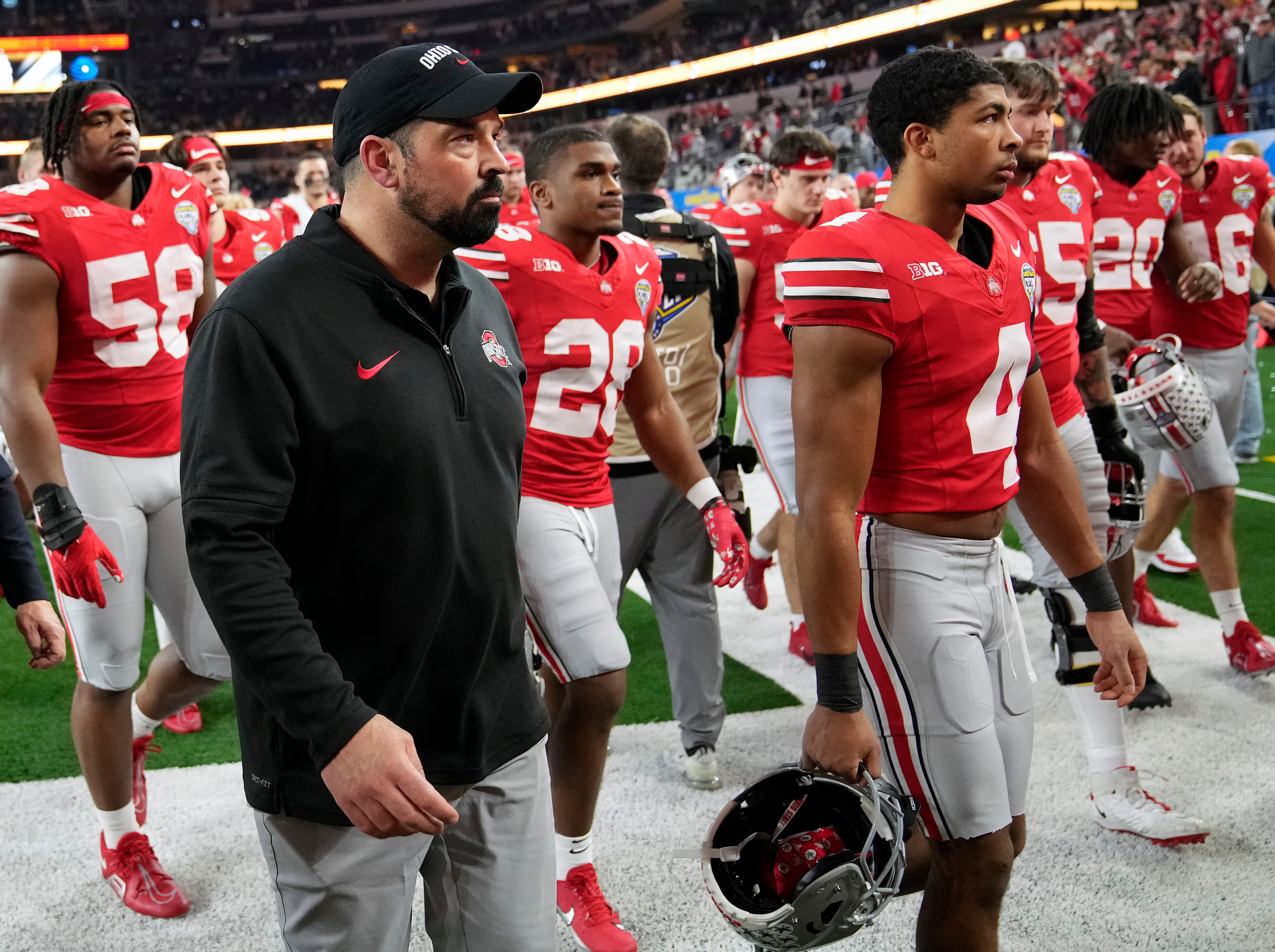 Dec 29, 2023; Arlington, TX, USA; Ohio State Buckeyes head coach Ryan Day walks off the field after losing 14-3 to Missouri Tigers in the Goodyear Cotton Bowl Classic at AT&T Stadium.