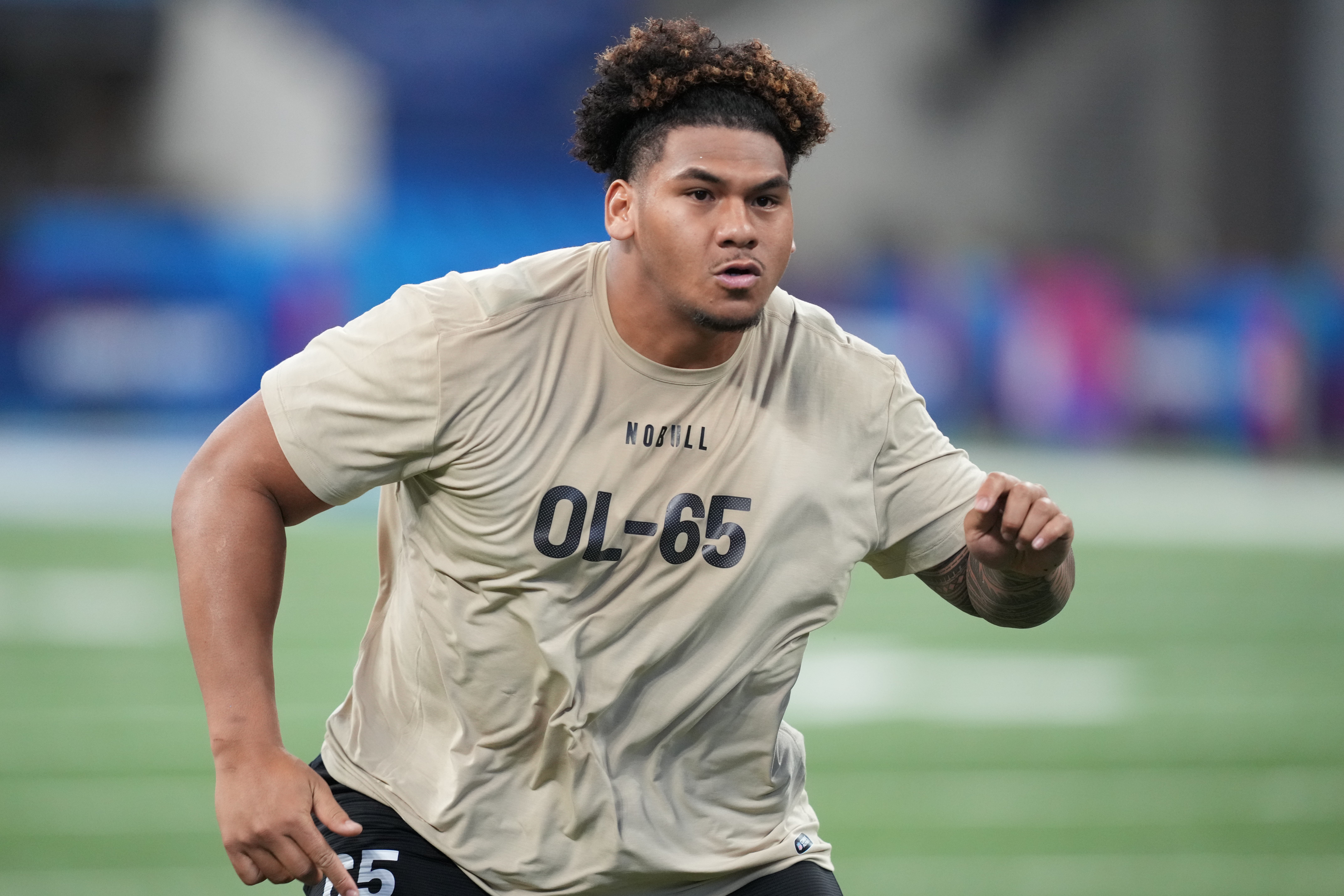 Mar 3, 2024; Indianapolis, IN, USA; Brigham Young offensive lineman Kingsley Suamataia (OL65) during the 2024 NFL Combine at Lucas Oil Stadium.