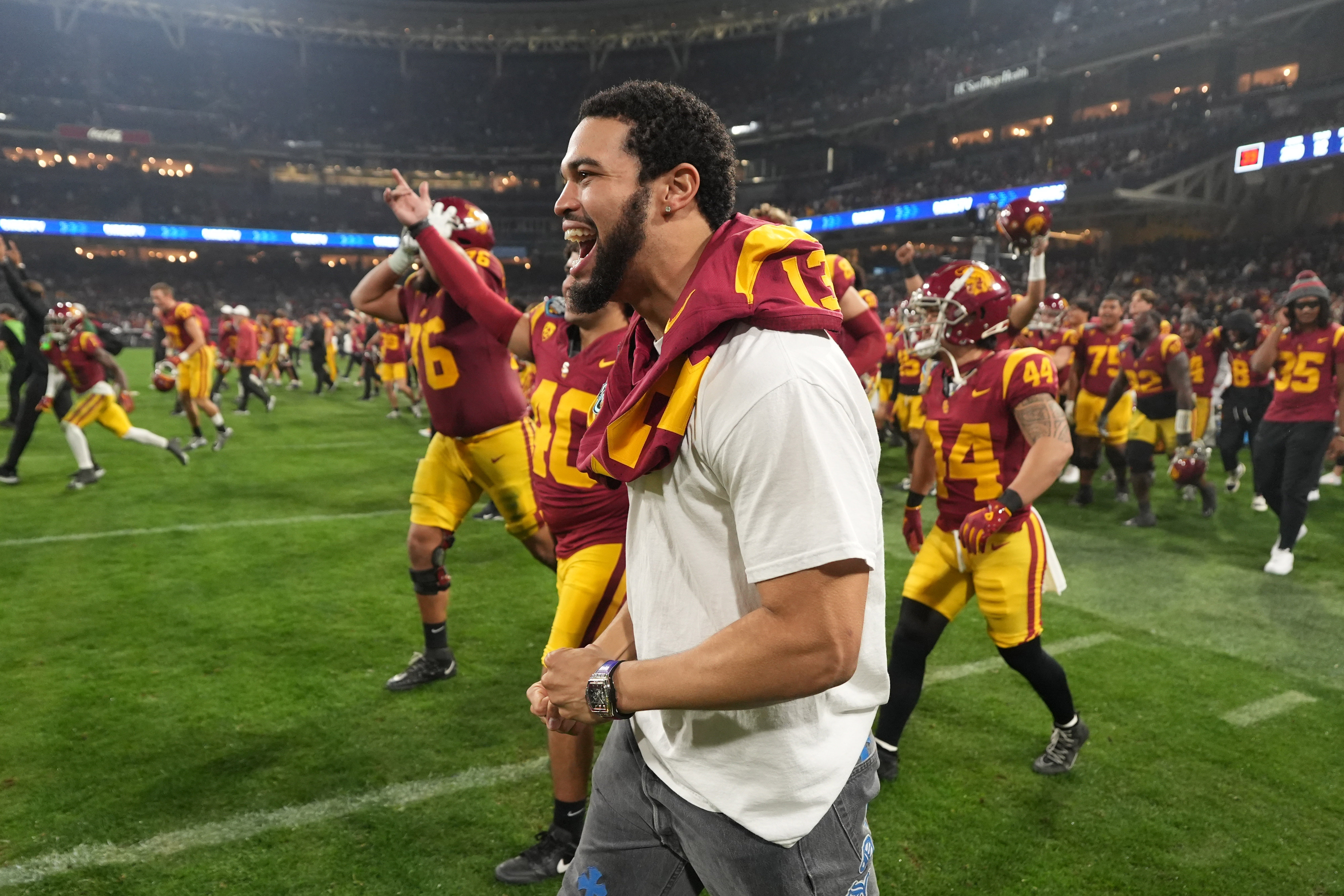 Dec 27, 2023; San Diego, CA, USA; Southern California Trojans quarterback Caleb Williams (13) celebrates after the Holiday Bowl against the Louisville Cardinals at Petco Park.