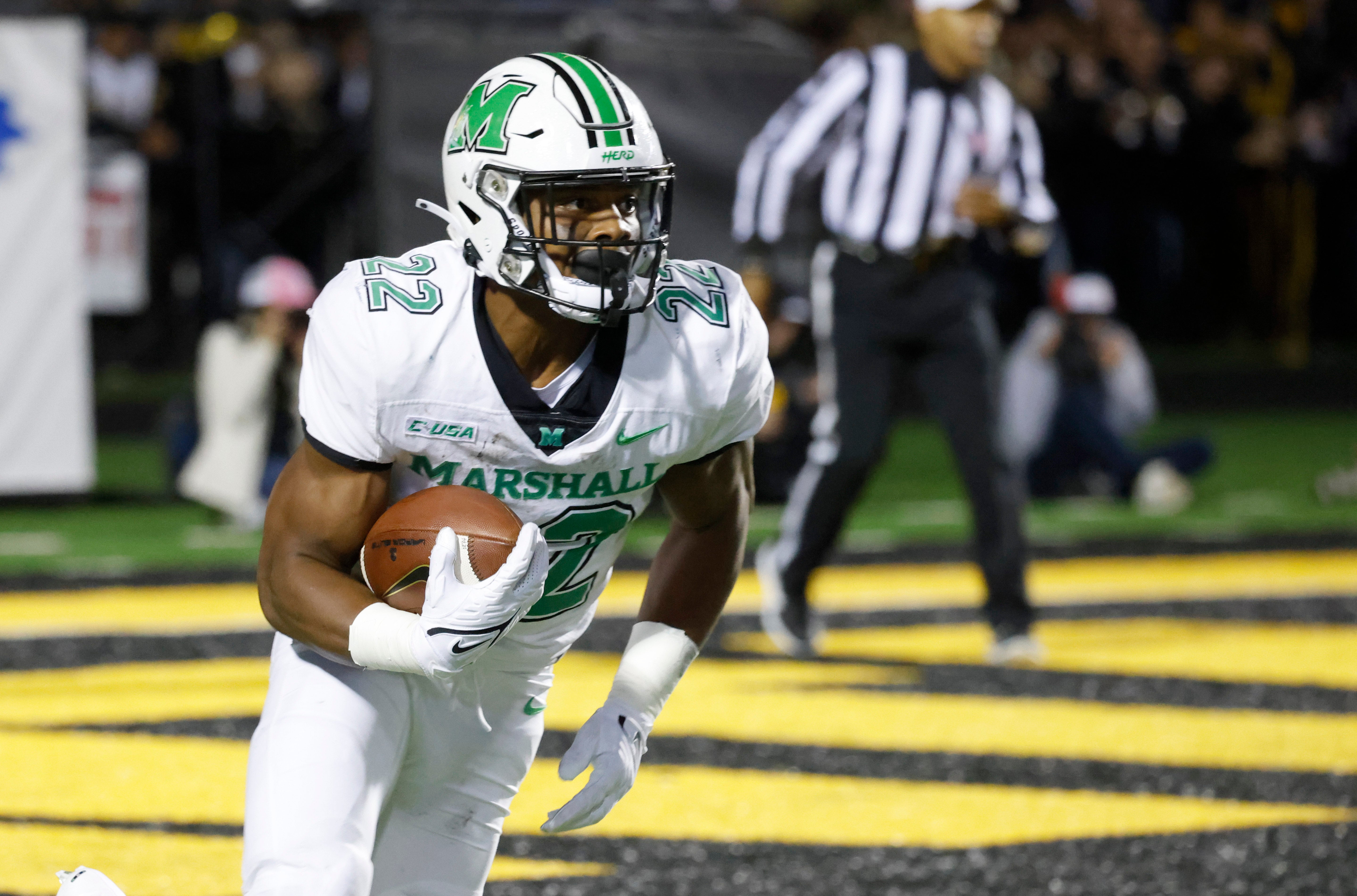 Sep 23, 2021; Boone, North Carolina, USA; Marshall Thundering Herd running back Rasheen Ali (22) runs back a kickoff for a touchdown during the second quarter against the Appalachian State Mountaineers at Kidd Brewer Stadium.