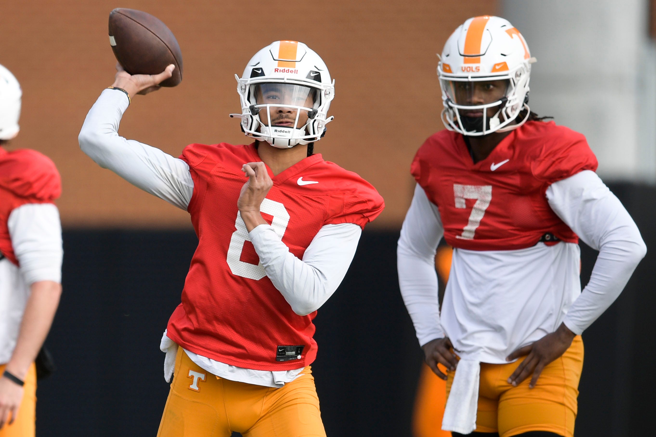 Tennessee quarterback Nico Iamaleava (8) throws a pass beside Tennessee quarterback Joe Milton III (7) during Tennessee football practice at Haslam Field in Knoxville, Tenn., on Saturday, Dec. 17, 2022.