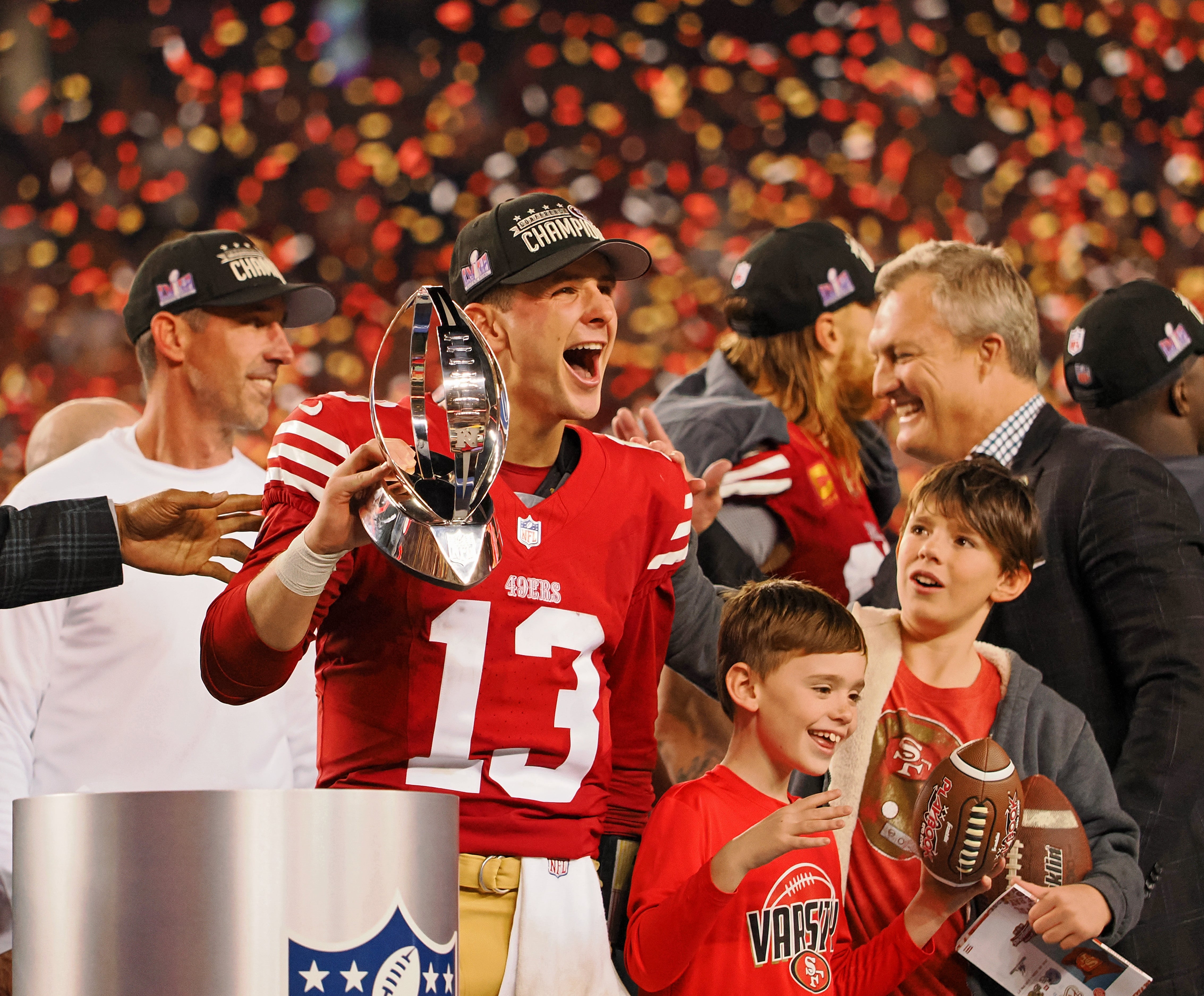 Jan 28, 2024; Santa Clara, California, USA; San Francisco 49ers quarterback Brock Purdy (13) holds the George Halas Trophy while after winning the NFC Championship football game against the Detroit Lions at Levi's Stadium.