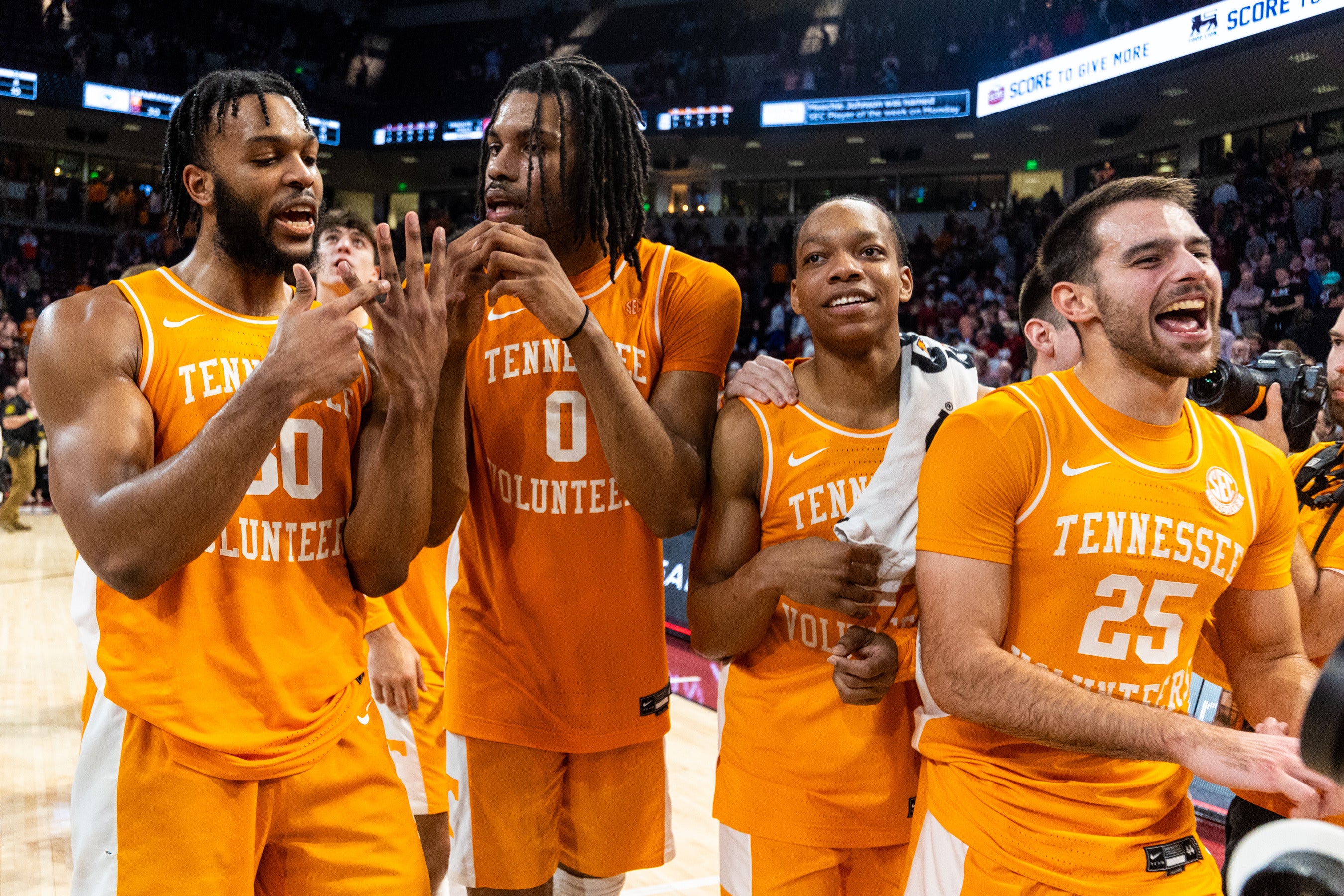 Mar 6, 2024; Columbia, South Carolina, USA; Tennessee Volunteers guard Josiah-Jordan James (30), forward Jonas Aidoo (0), guard Jordan Gainey (2) and guard Santiago Vescovi (25) celebrate following their win against the South Carolina Gamecocks at Colonial Life Arena.