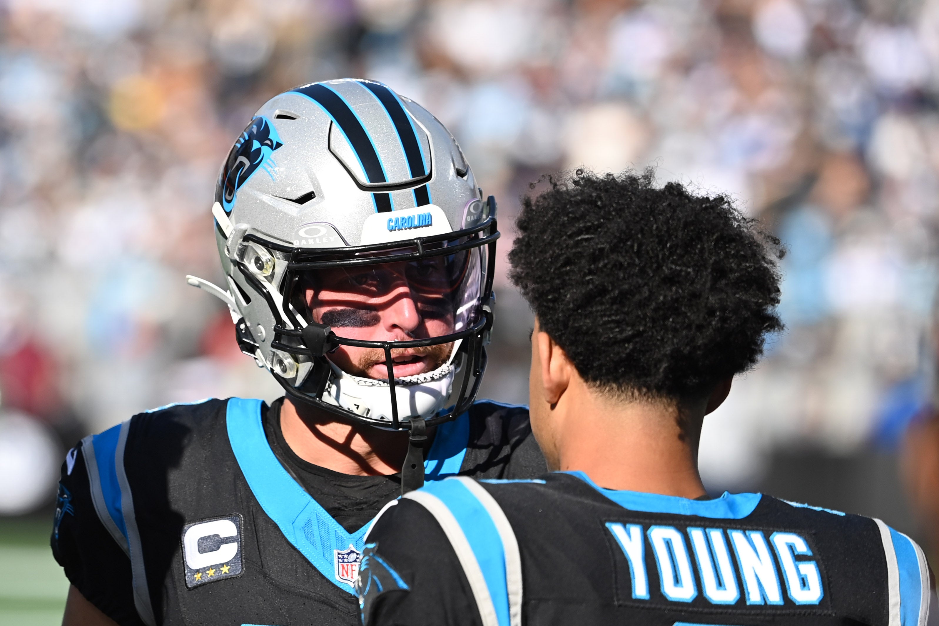 Nov 19, 2023; Charlotte, North Carolina, USA; Carolina Panthers wide receiver Adam Thielen (19) talks to quarterback Bryce Young (9) in the second quarter at Bank of America Stadium. Mandatory Credit: Bob Donnan-USA TODAY Sports