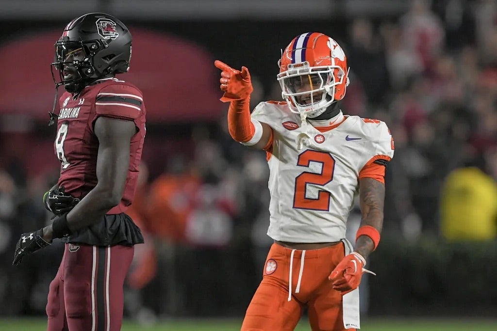 Clemson Tigers cornerback Nate Wiggins (2) smiles after breaking up a pass to South Carolina wide receiver Nyck Harbor (8) during the fourth quarter at Williams-Brice Stadium.