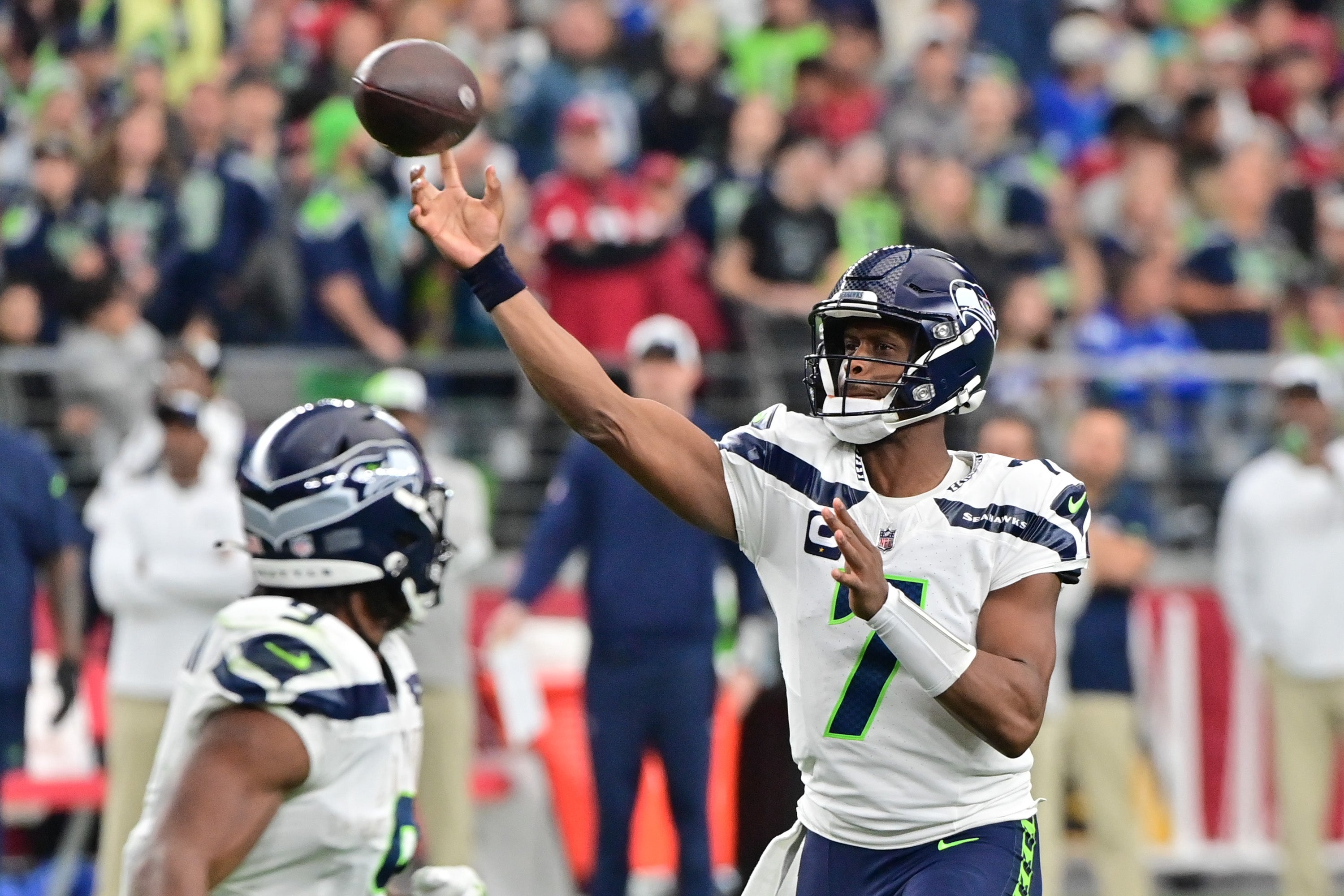 Jan 7, 2024; Glendale, Arizona, USA; Seattle Seahawks quarterback Geno Smith (7) throws in the first half against the Arizona Cardinals at State Farm Stadium.