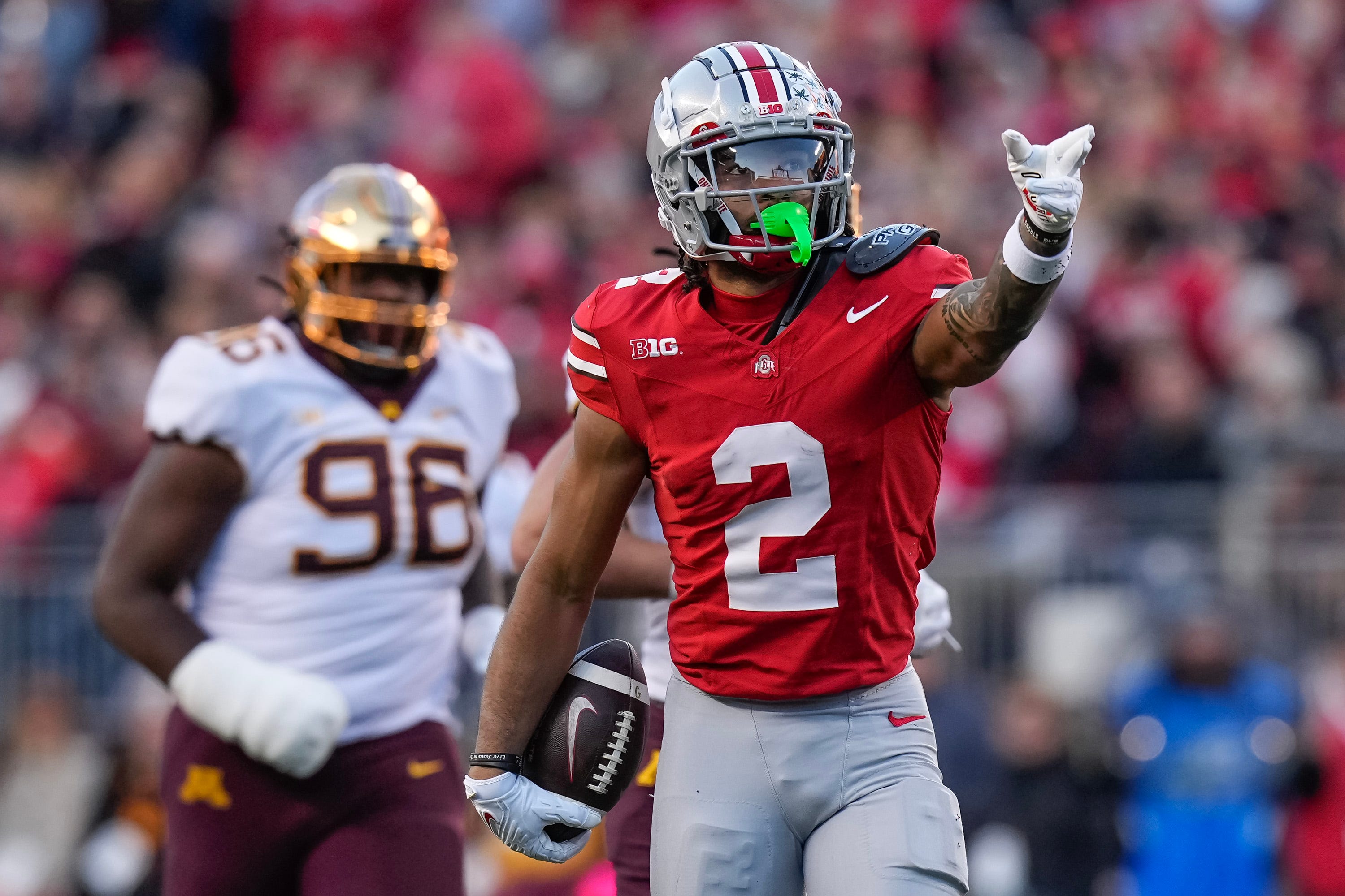 Nov 18, 2023; Columbus, Ohio, USA; Ohio State Buckeyes wide receiver Emeka Egbuka (2) celebrates a first down catch during the NCAA football game against the Minnesota Golden Gophers at Ohio Stadium.