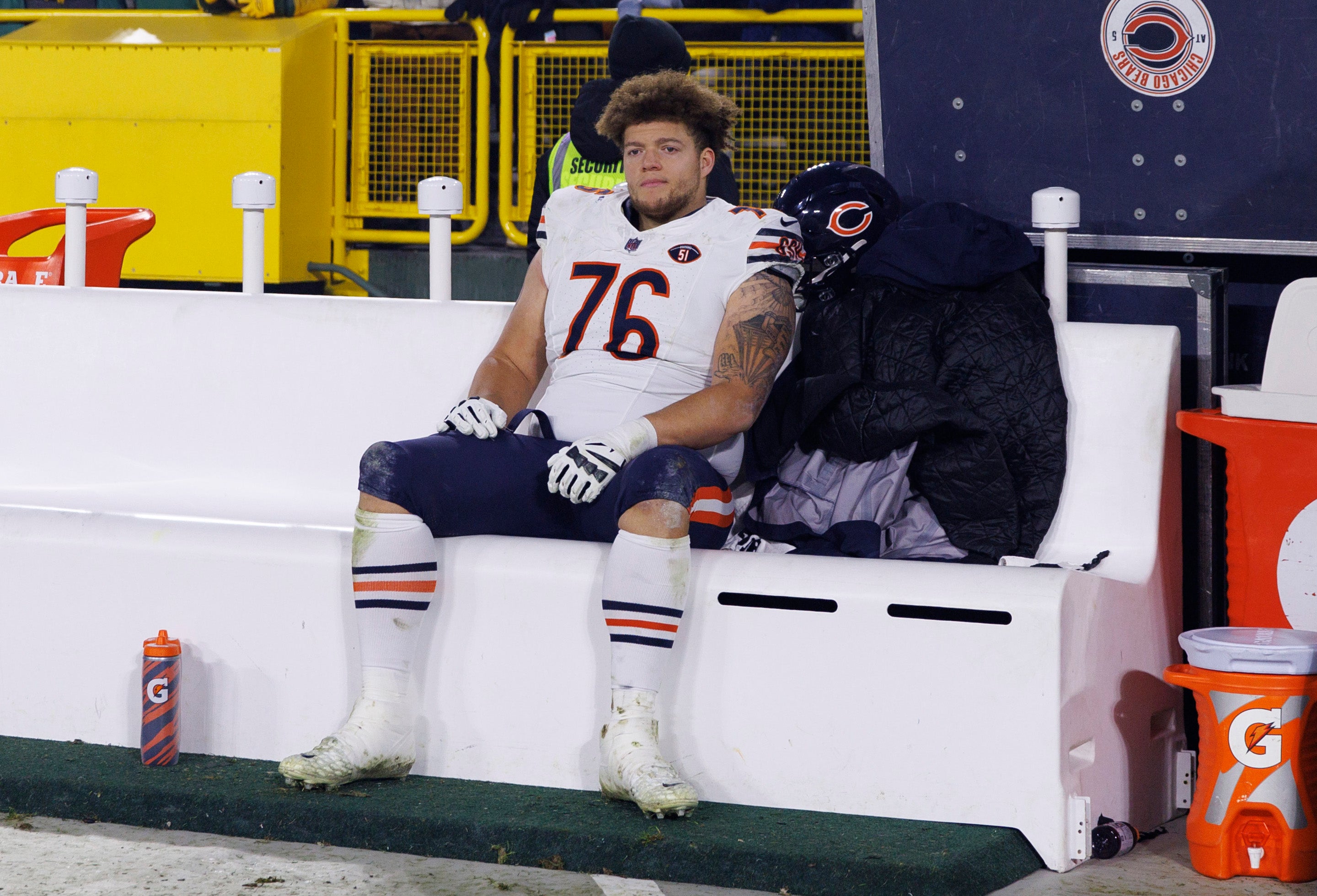 Jan 7, 2024; Green Bay, Wisconsin, USA; Chicago Bears offensive linenam Teven Jenkins (76) sits on the bench following the game against the Green Bay Packers at Lambeau Field.
