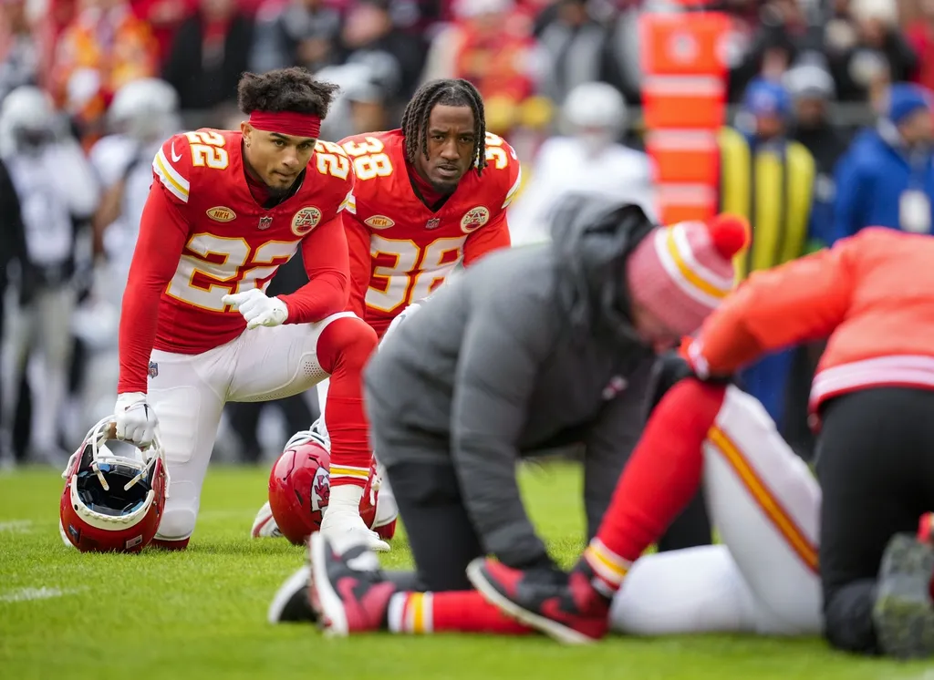 Kansas City Chiefs cornerback Trent McDuffie (22) and cornerback L'Jarius Sneed (38) look on as medical staff attend to safety Mike Edwards (21) during the first half against the Las Vegas Raiders at ...